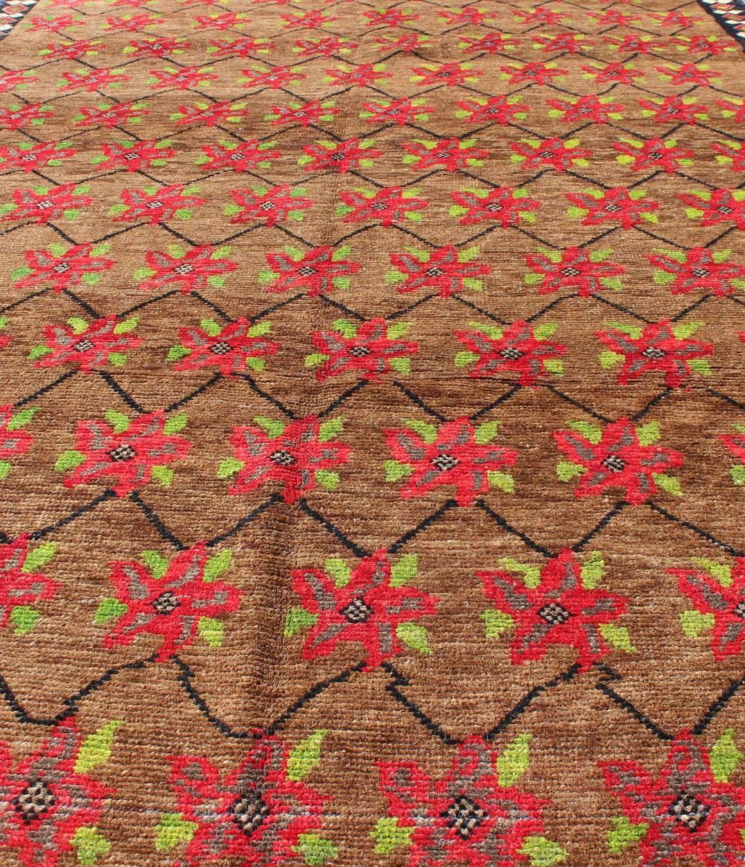 Wool Turkish Oushak  with Poinsettia Design Set Atop Light Brown Background For Sale
