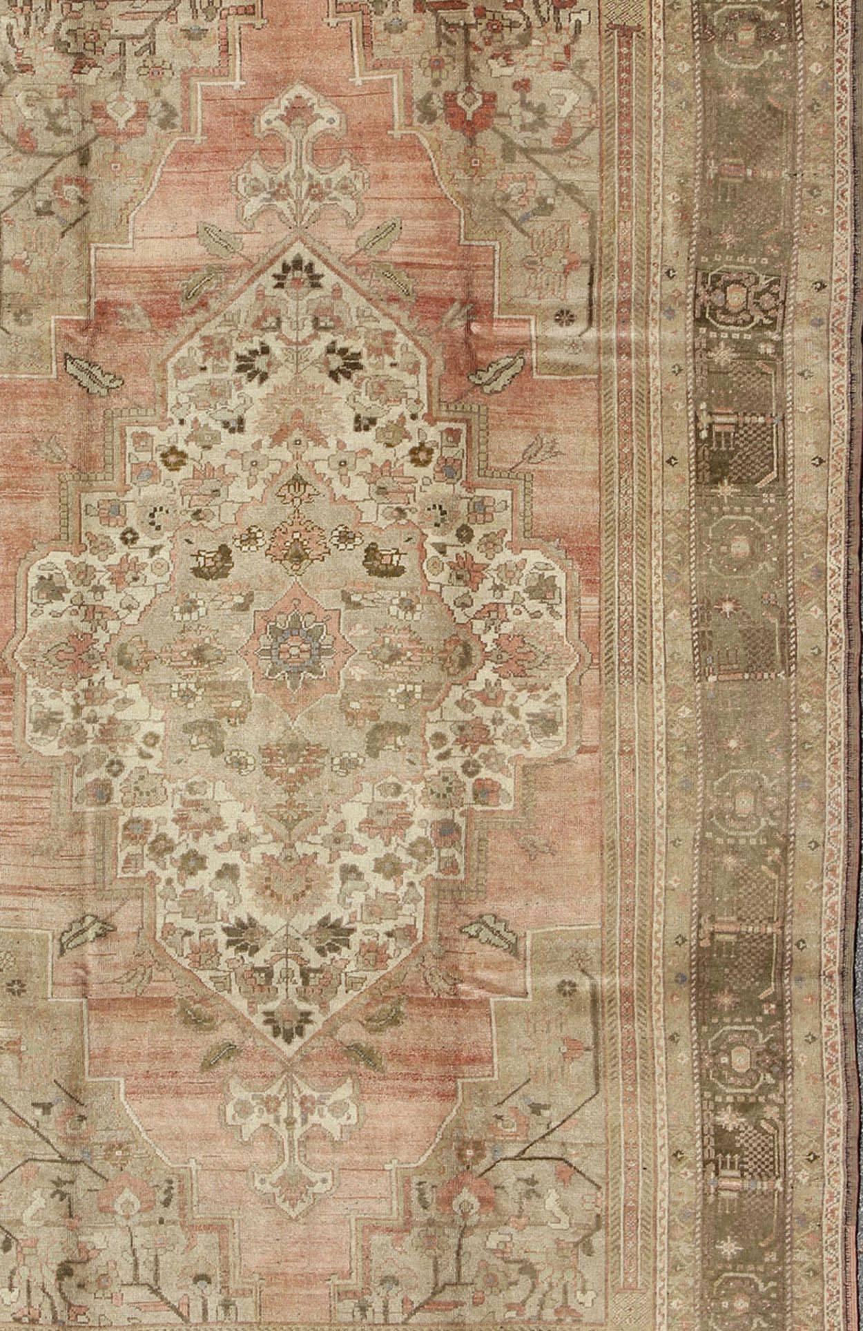 Hand-Knotted Vintage Turkish Oushak Carpet with Faint Salmon Field and Elegant Floral Motifs For Sale
