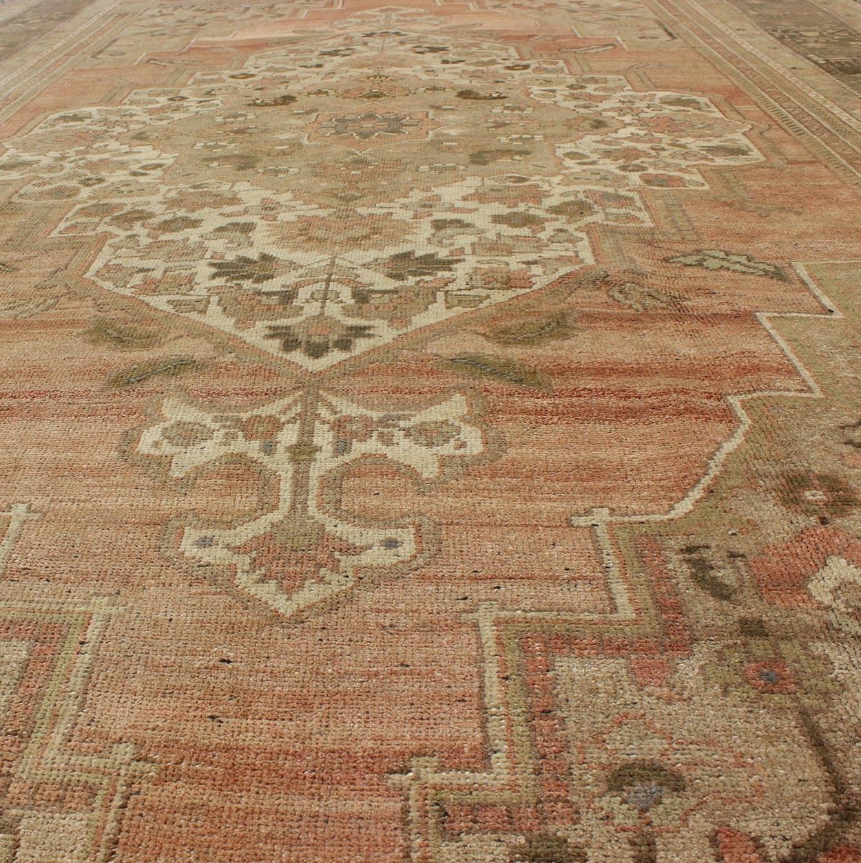 20th Century Vintage Turkish Oushak Carpet with Faint Salmon Field and Elegant Floral Motifs For Sale