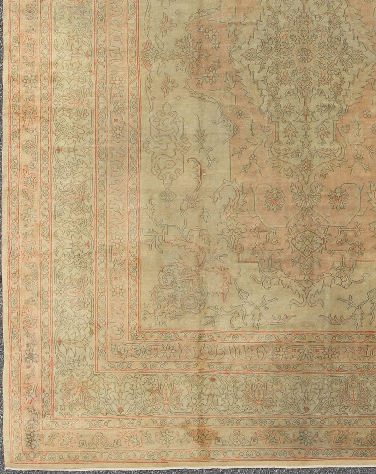 Antique Turkish Oushak Carpet with Intricate Medallion Design, Keivan Woven Arts/ rug/13-0503,  origin/ Turkey, Circa 1910

Measures: 8.11 x 11.8.

This antique Turkish Oushak carpet from the early 20th century features a remarkable soft color