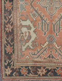 Antique Oushak Rug from Turkey with Central Medallion and Sub-Geometric Elements