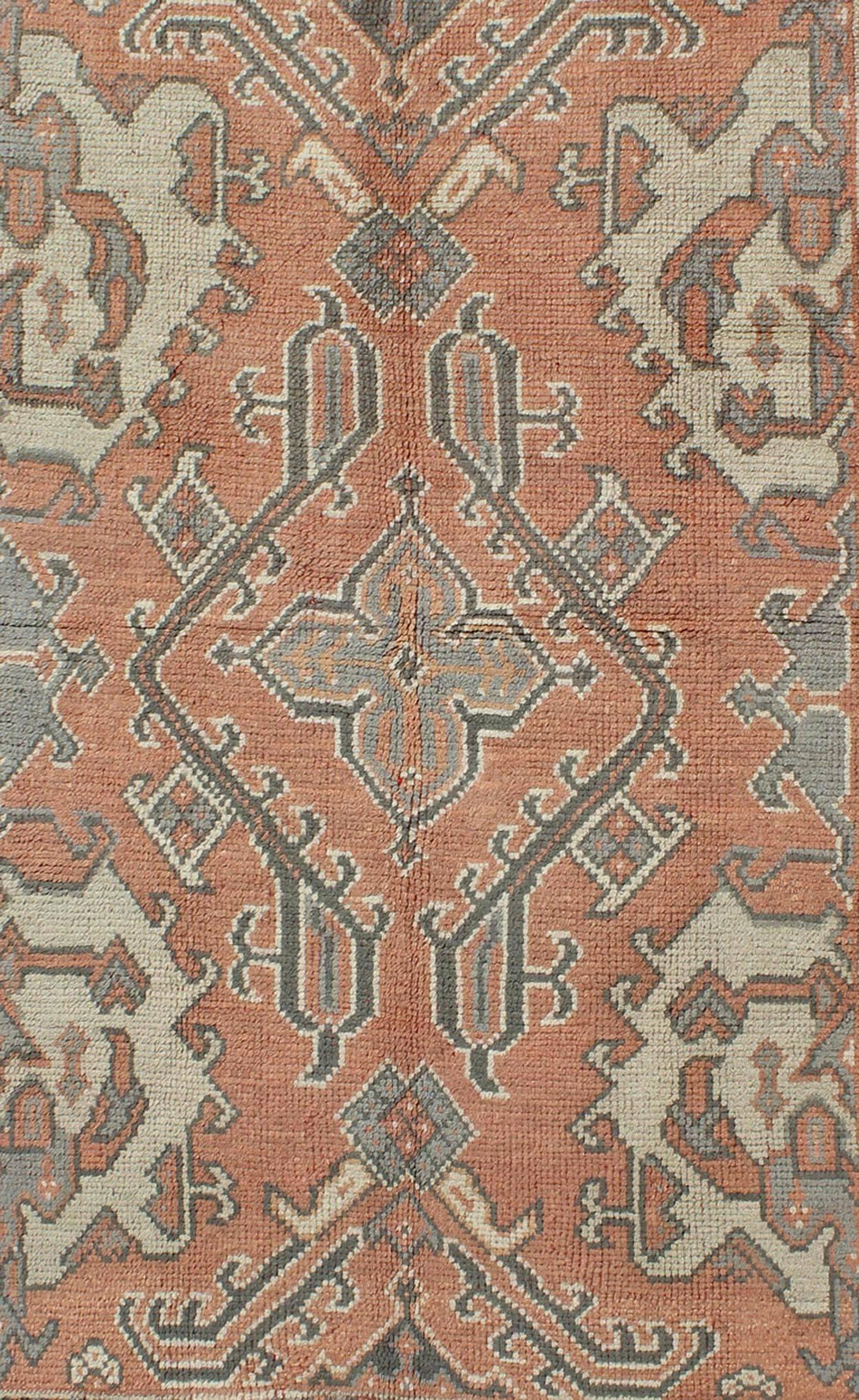 Turkish Antique Oushak Rug from Turkey with Central Medallion and Sub-Geometric Elements For Sale