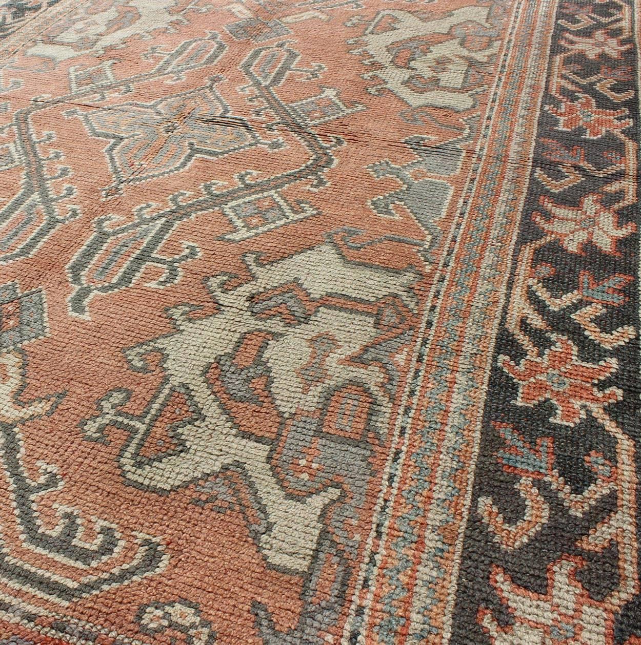 Antique Oushak Rug from Turkey with Central Medallion and Sub-Geometric Elements In Good Condition For Sale In Atlanta, GA