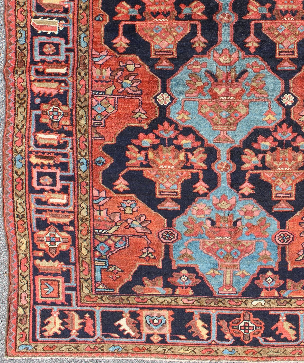 Persian Khamseh Antique in Terra Cotta and Ink Blue 
rug/10-ke-313   origin/ Iran

This wonderful, late 19th century carpet features a masterfully woven deep ink blue field of sub-geometric motifs, with light blue and terra cotta. The wide blue