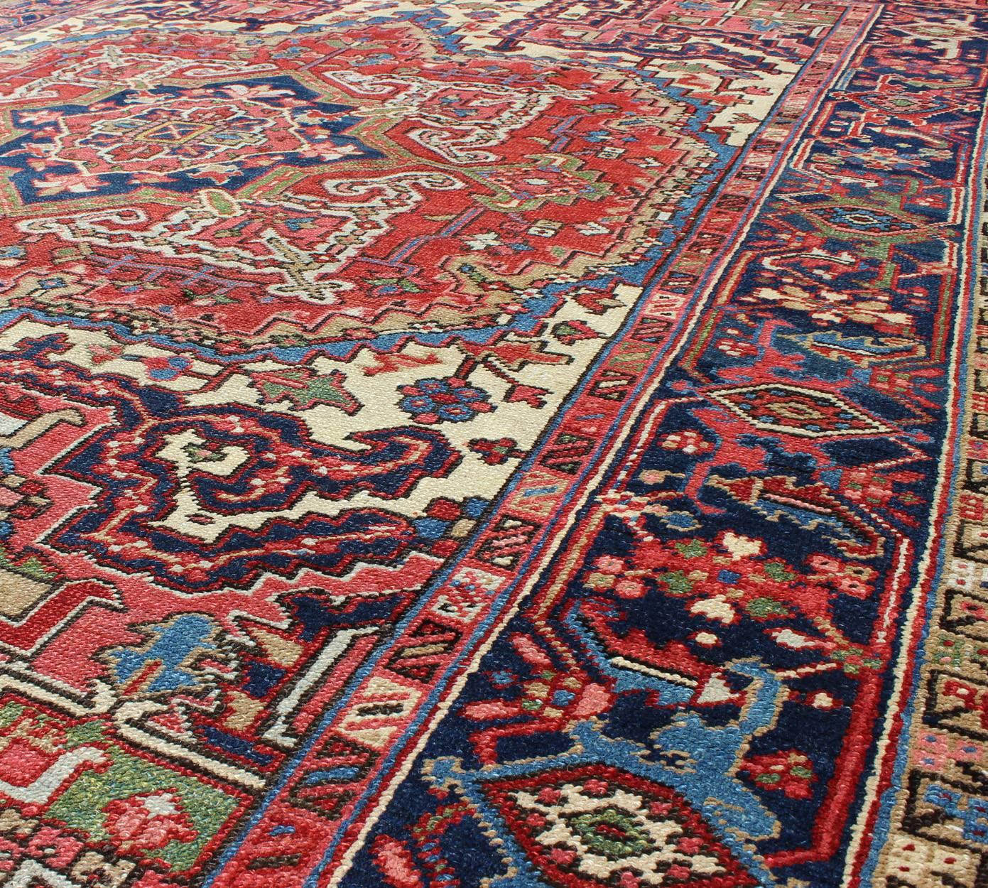 Antique Persian Heriz Carpet with Stylized Central Medallion in Warm Hues of Red In Excellent Condition In Atlanta, GA