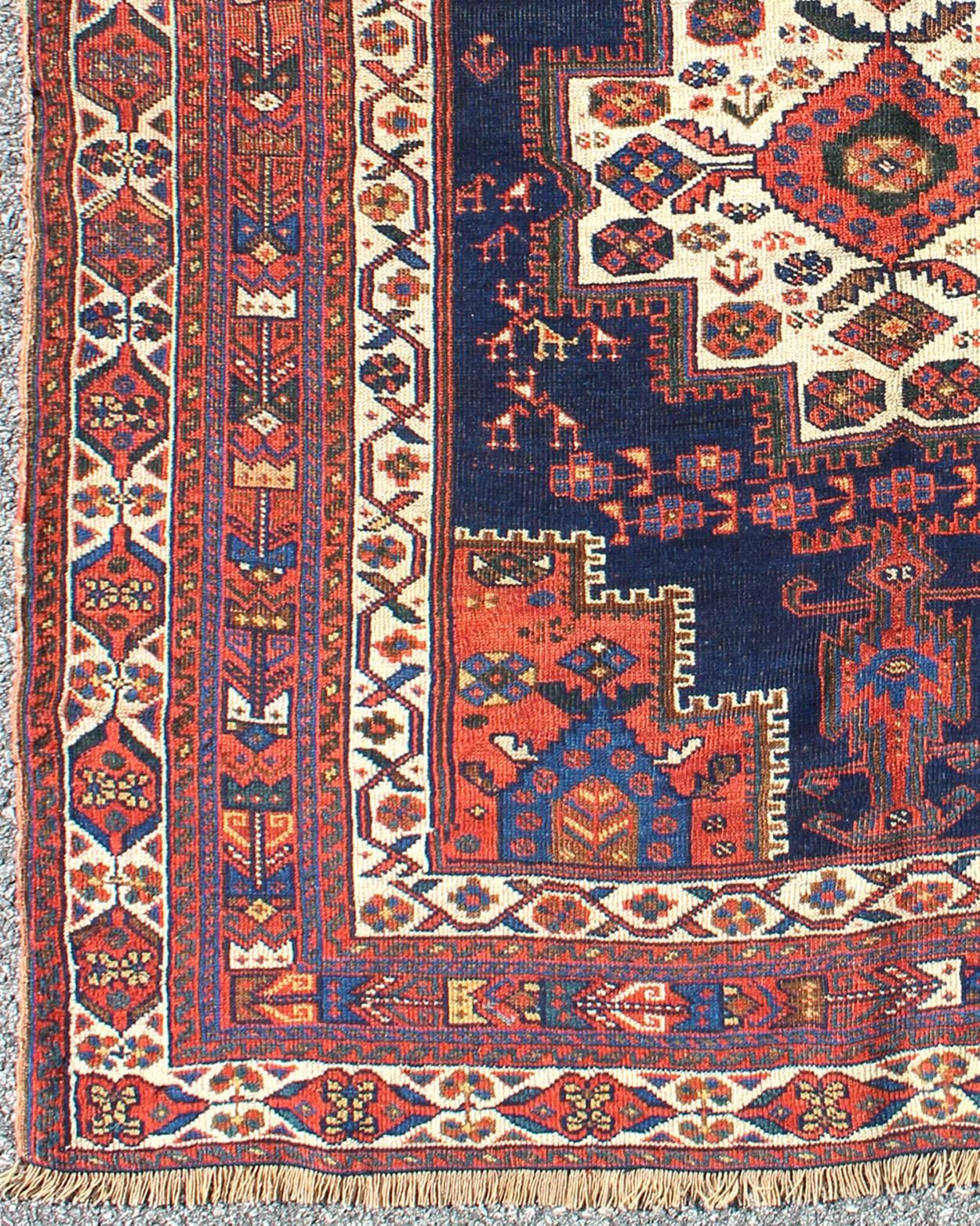 Bold geometry, rich symbolism and vivid, singular coloration contribute to the marvelous beauty of this stunning piece. Handwoven by Afshar tribal artists in southeastern Iran, the piece’s sophisticated artistry begins in the outer borders, evident