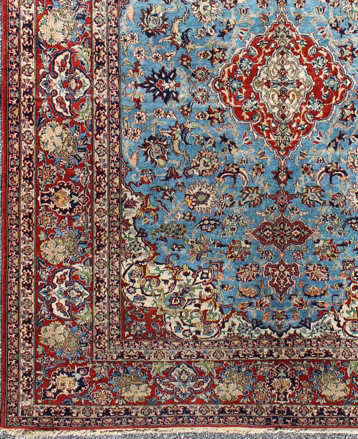 This outstanding Persian Isfahan carpet is primarily characterized by its classical composition. This beautiful carpet represents the highest levels of mastery achieved by Persian weavers. It showcases floral elements and vine scrolls that are