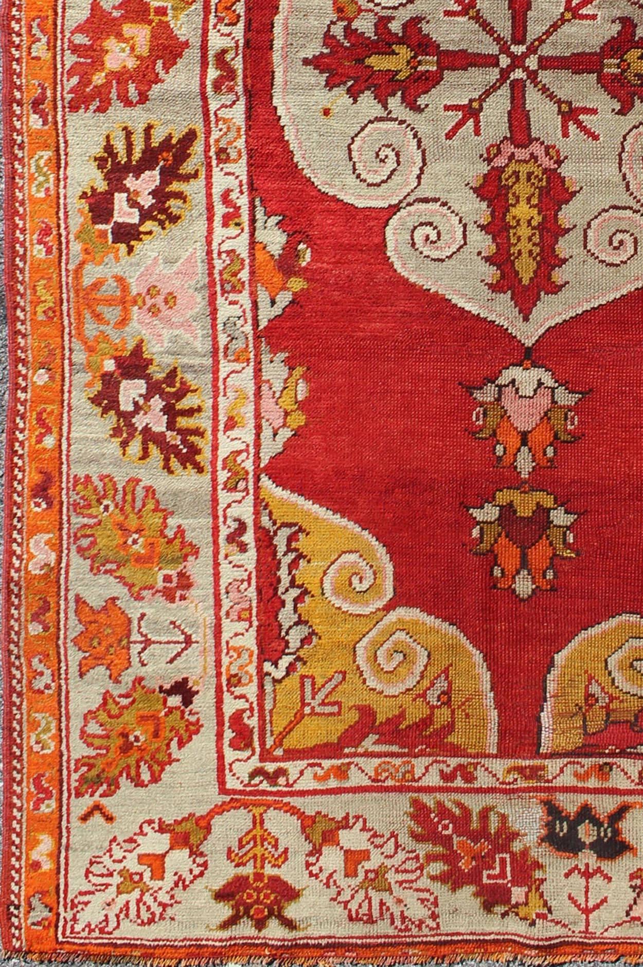 Antique Turkish Oushak Rug with Bright Red Ground with medallion Design  Keivan Woven Arts/ rug/L11-0601,  origin/turkey

This beautiful antique rug from Turkey features a Classic Oushak design, which is enhanced by lustrous wool. The bright red