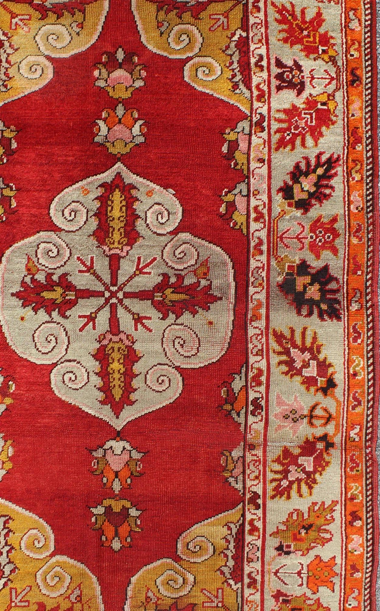 Center Medallion Antique Turkish Oushak Rug with Red Ground & Multi Colors In Good Condition For Sale In Atlanta, GA
