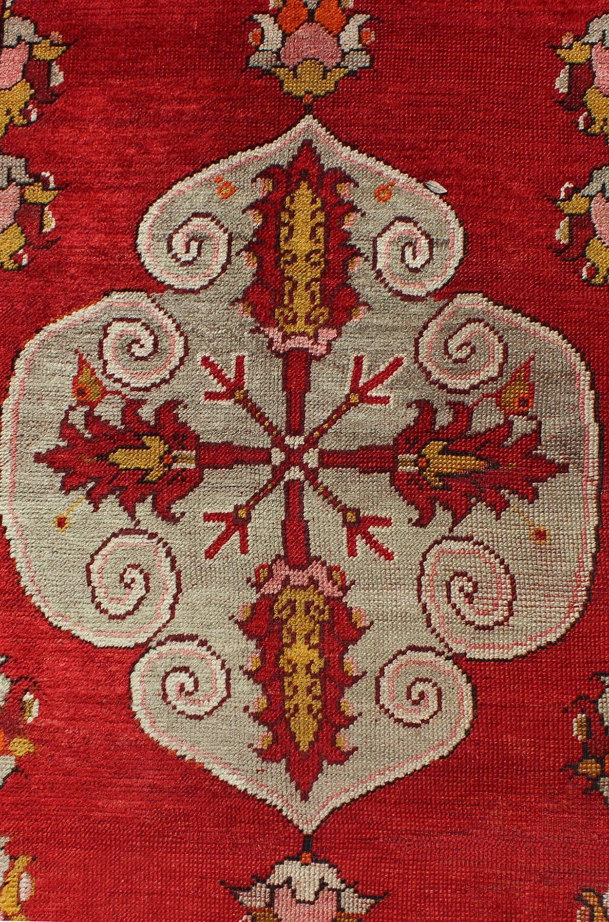 Wool Center Medallion Antique Turkish Oushak Rug with Red Ground & Multi Colors For Sale