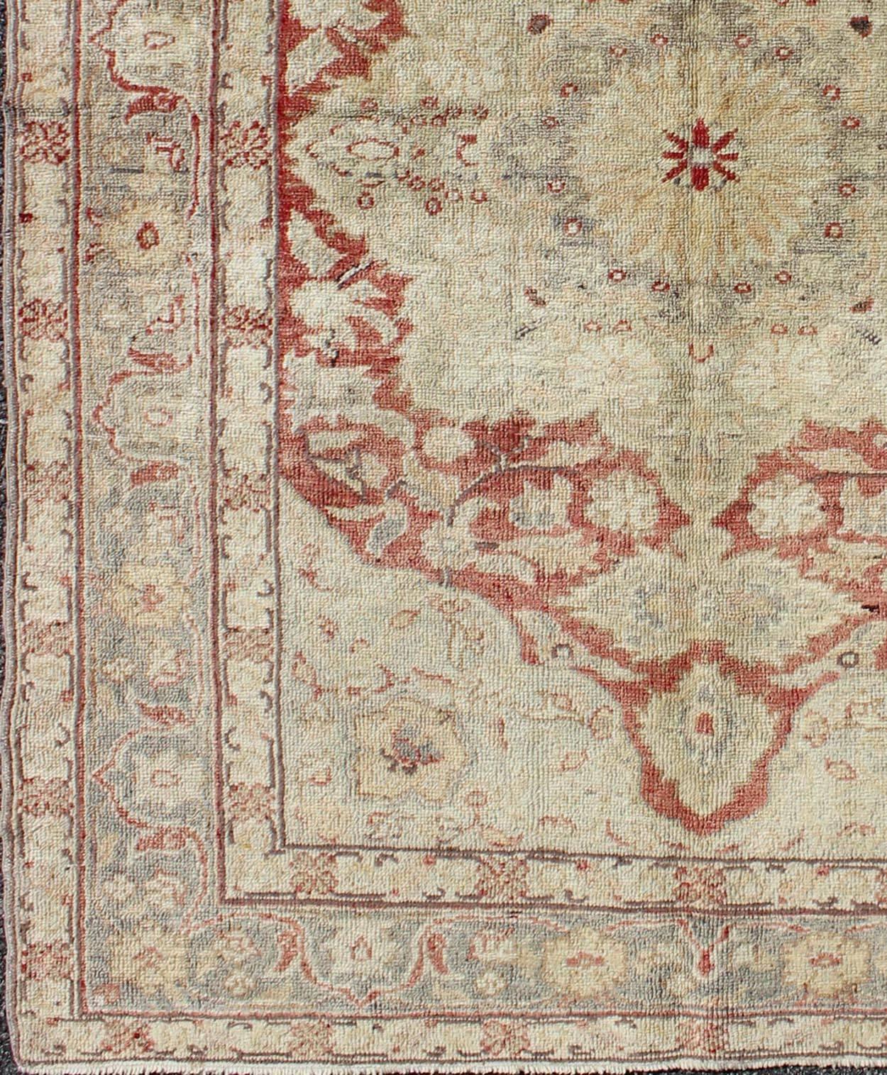 Fine Turkish Oushak Carpet with Center Medallion in Light Red 
rug/na-63630,  origin. turkey

This spectacular Turkish Oushak bears magnificent splendor indicative of royal tastes, which sought perfection in balance and palette. The center medallion