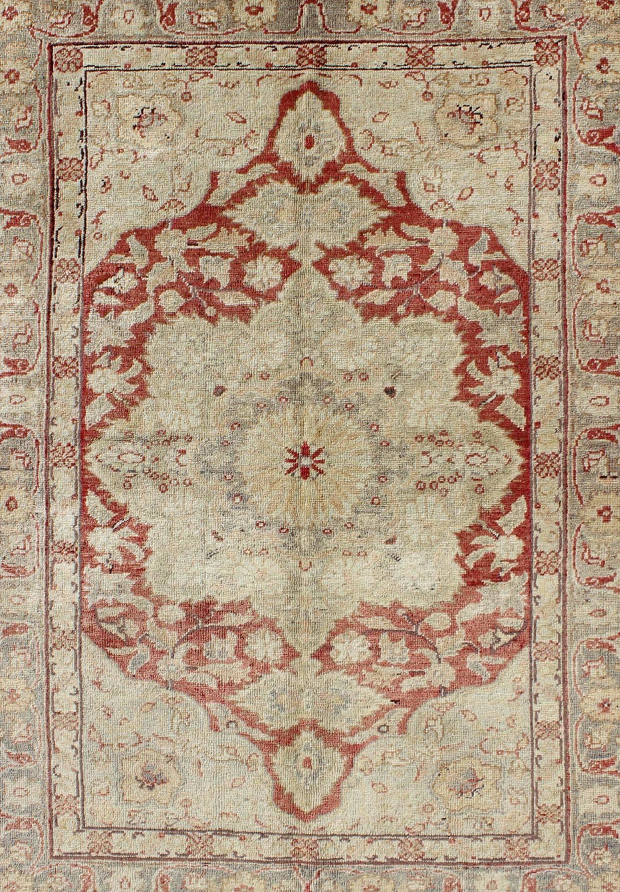 Hand-Knotted Fine Turkish Oushak Carpet with Center Medallion in Light Red and Cream For Sale