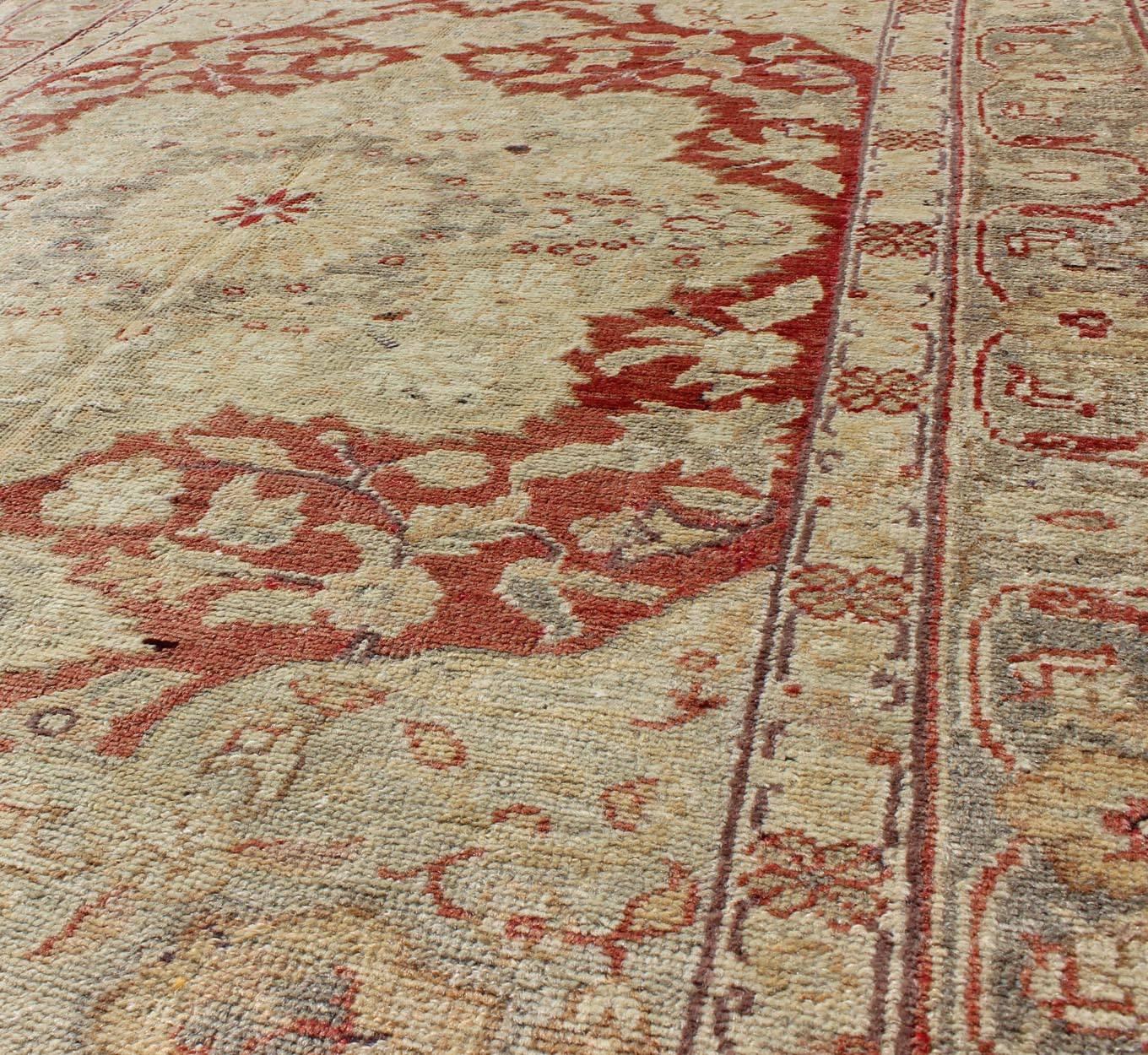 20th Century Fine Turkish Oushak Carpet with Center Medallion in Light Red and Cream For Sale