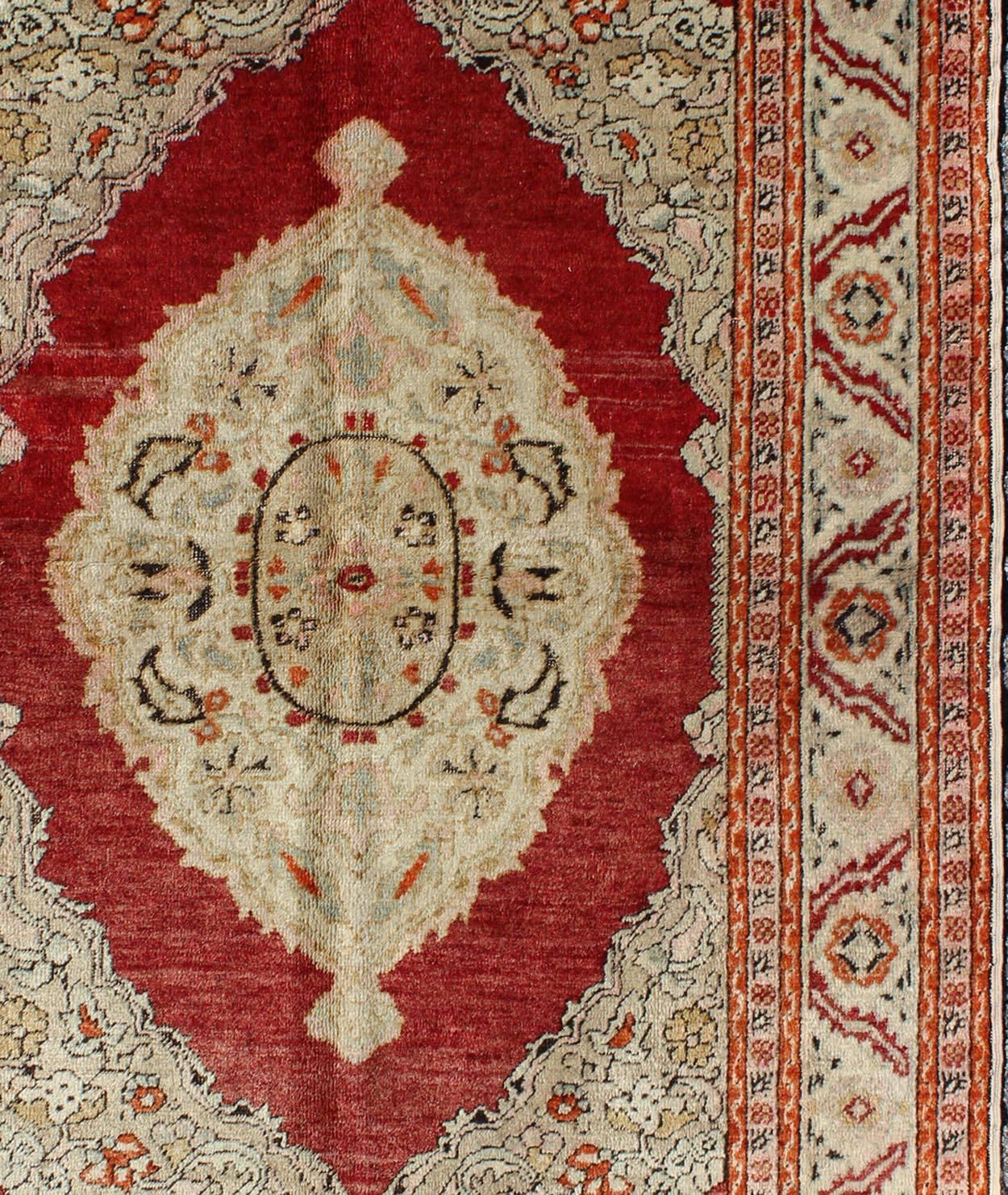 Hand-Knotted Antique Oushak Rug with Floral Medallion in Light Green, Ivory, Taupe & Red For Sale