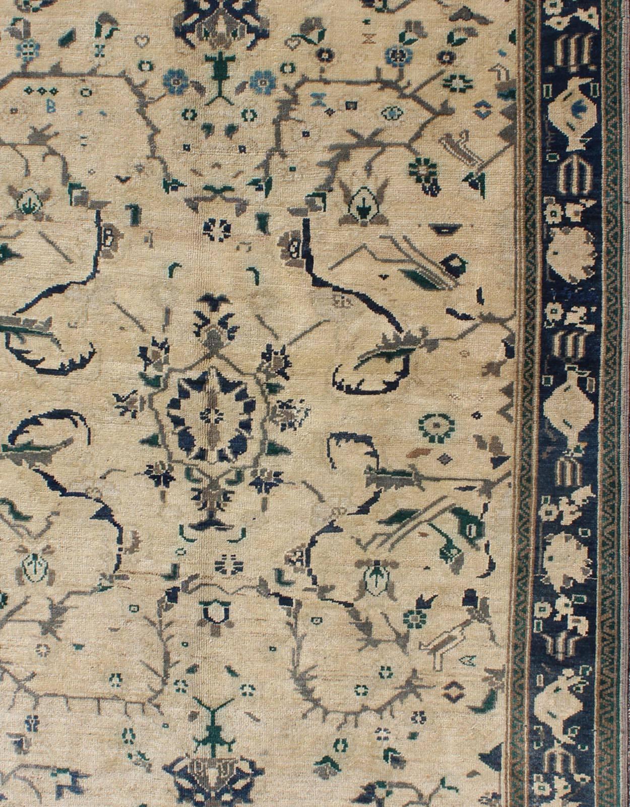 Hand-Knotted Vintage Turkish Oushak Rug with Vining Florals in Cream and Sapphire Blue For Sale