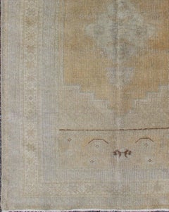 Vintage Turkish Oushak Rug in Faded Gold and Soft Gray with Subtle Medallion