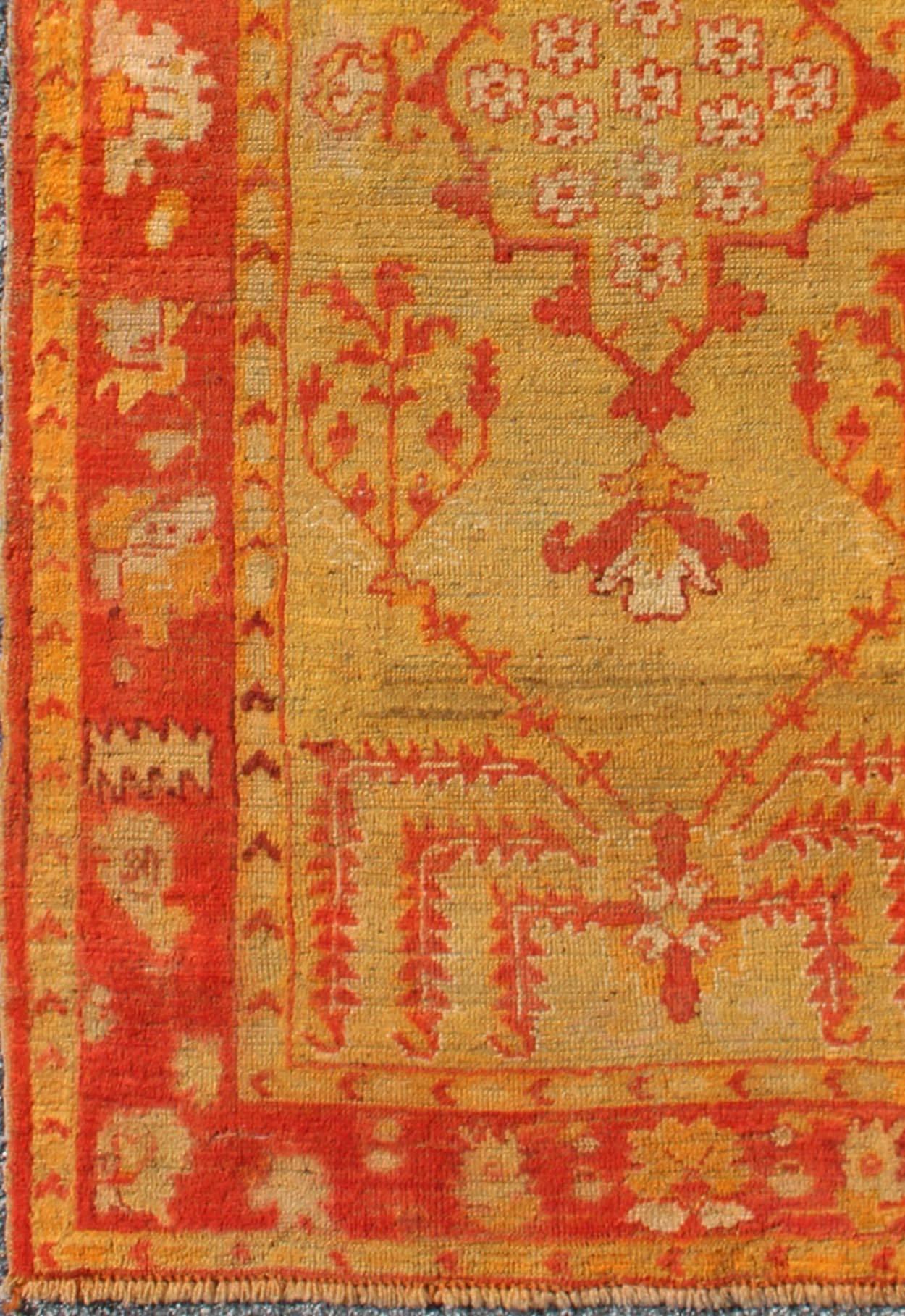 Antique Turkish Oushak Rug With Orange Red and Yellow-Green and Medallion Design. Small Antique Oushak, Keivan Woven Arts/ rug/L11-1102 origin/Turkey, Style/ Oushak, small antique Oushak rug.

Measures: 3'1 x 5'3.

The stylized motifs in this unique