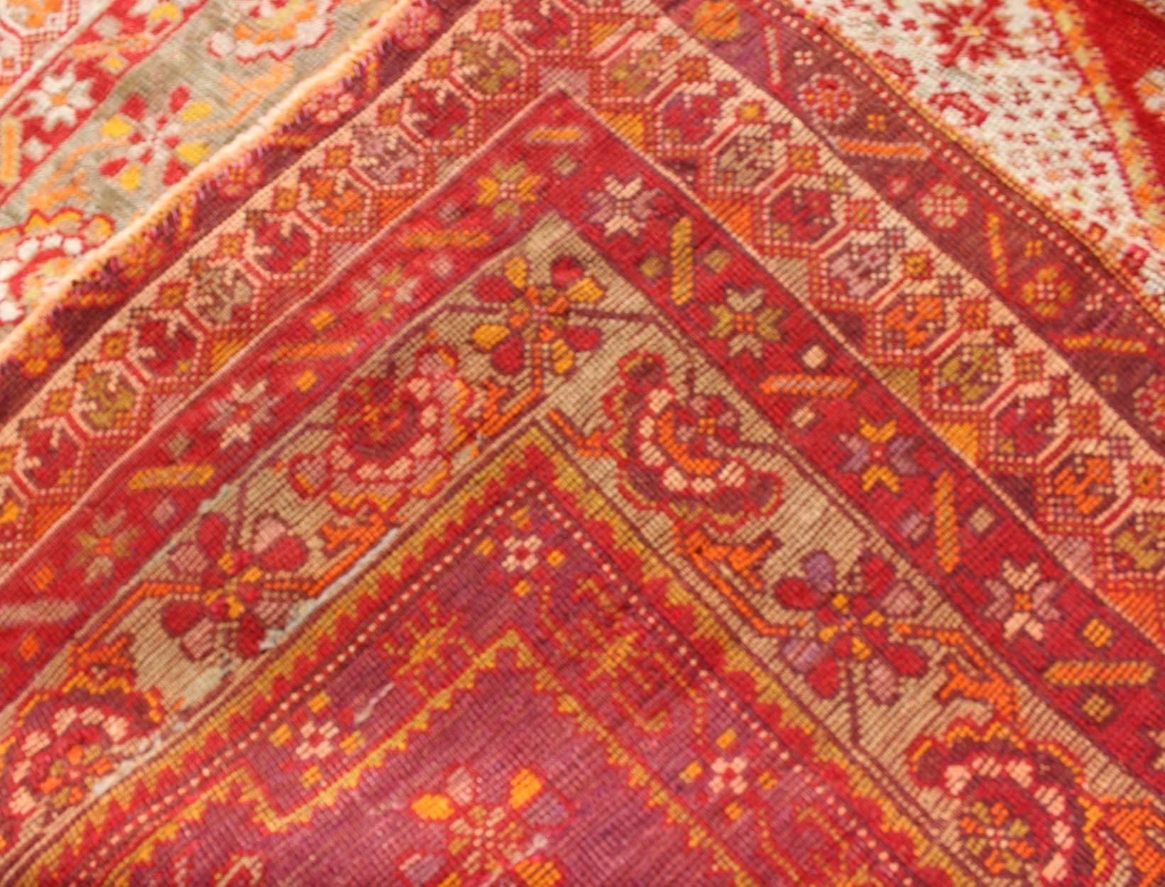 Wool Antique Turkish Oushak Rug with Colorful Flowing Floral and Geometric Motifs For Sale