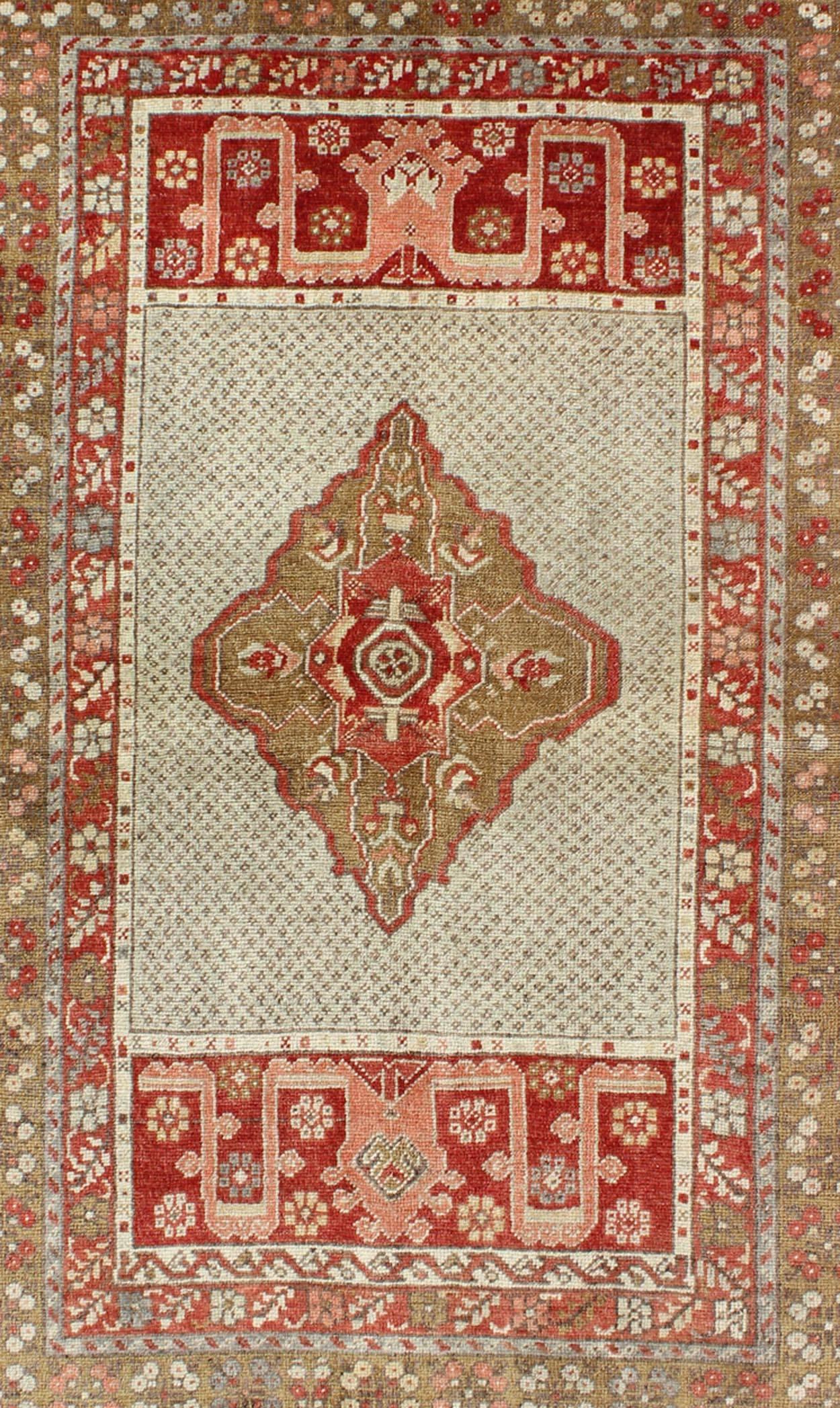 Hand-Knotted  Antique Medallion Turkish Small Oushak Carpet in Various Green Tones & Red For Sale