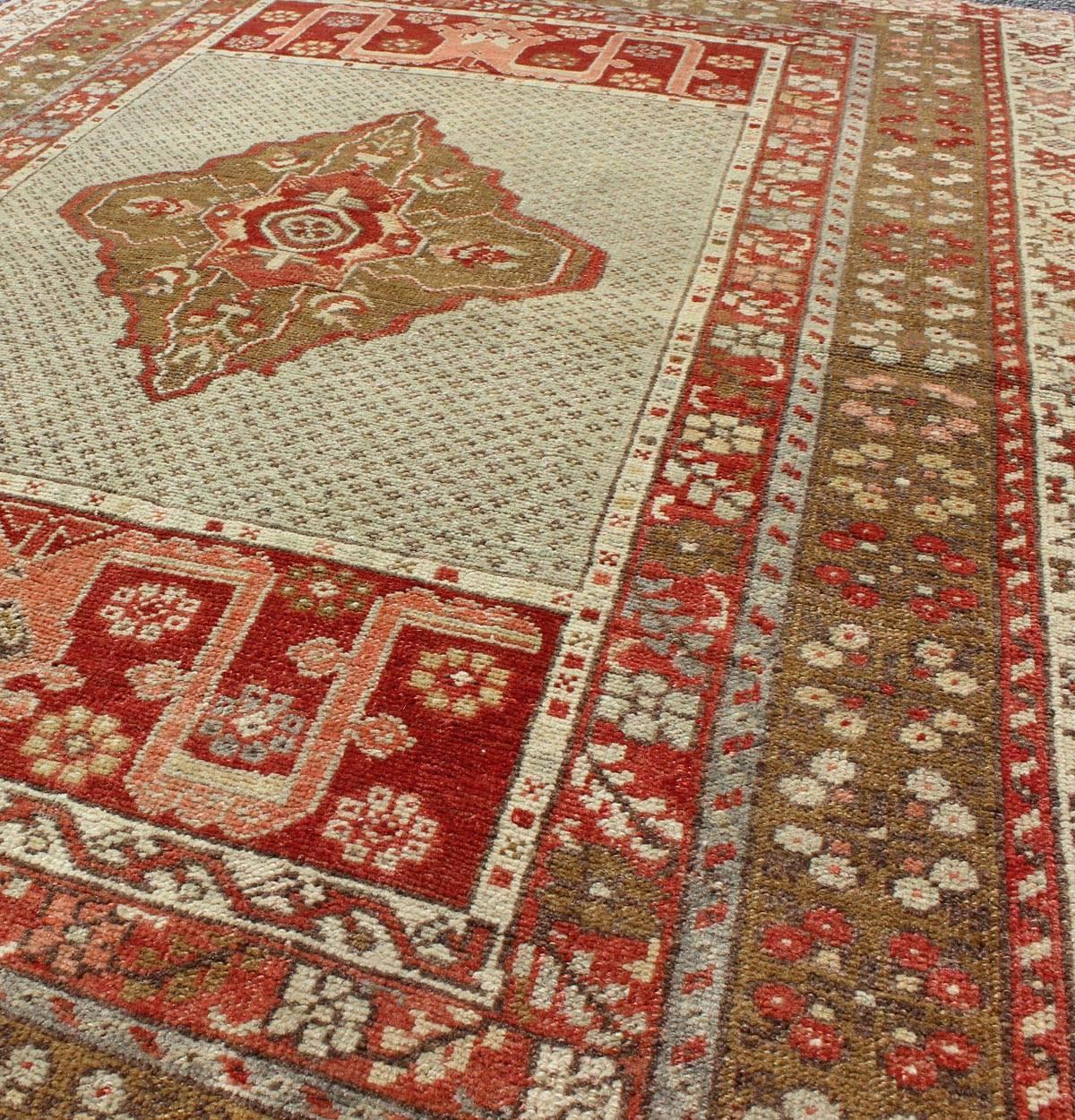 Early 20th Century  Antique Medallion Turkish Small Oushak Carpet in Various Green Tones & Red For Sale
