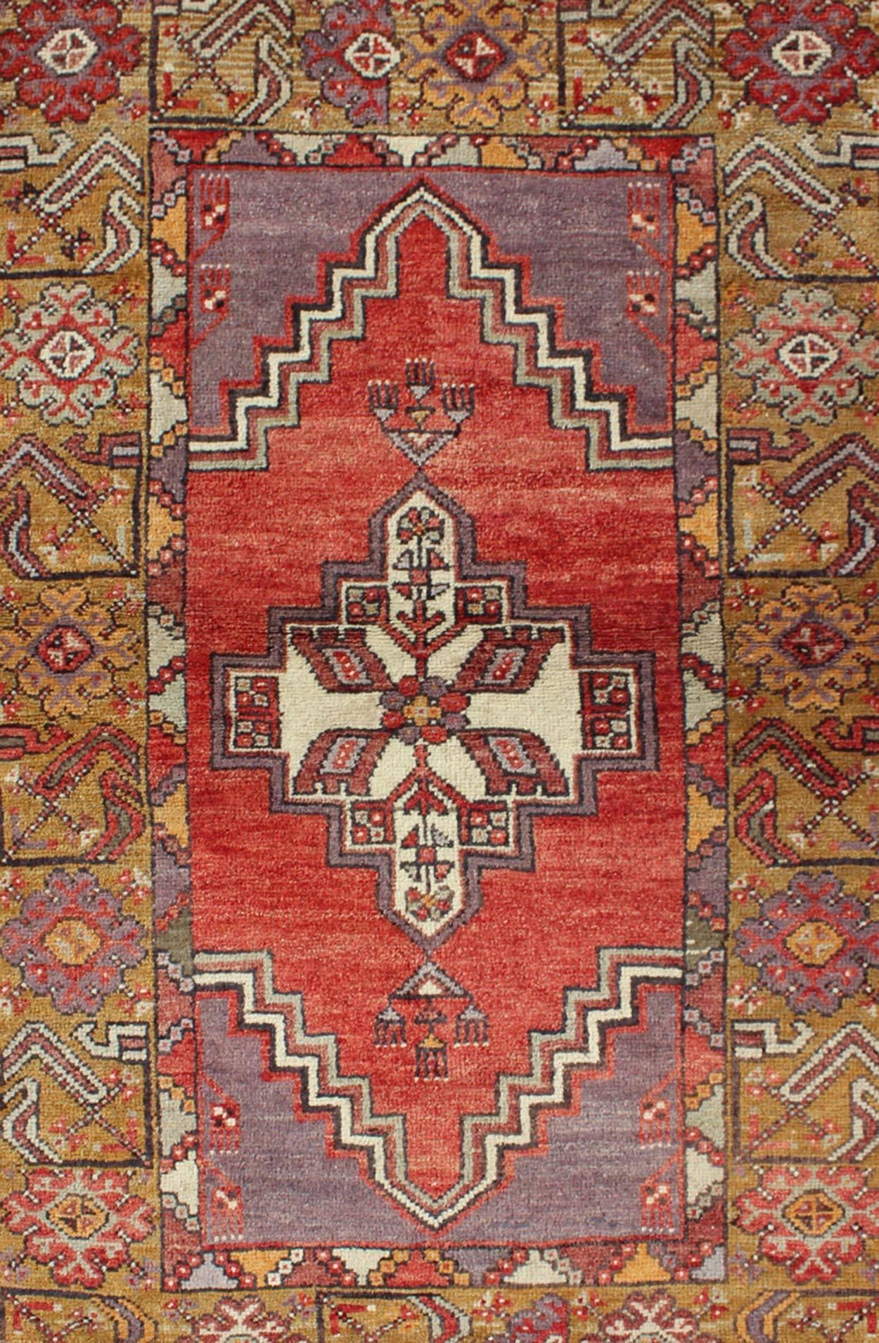 Hand-Knotted Geometric Vintage Turkish Oushak Carpet in soft Red, Light Purple, & Gold Border For Sale