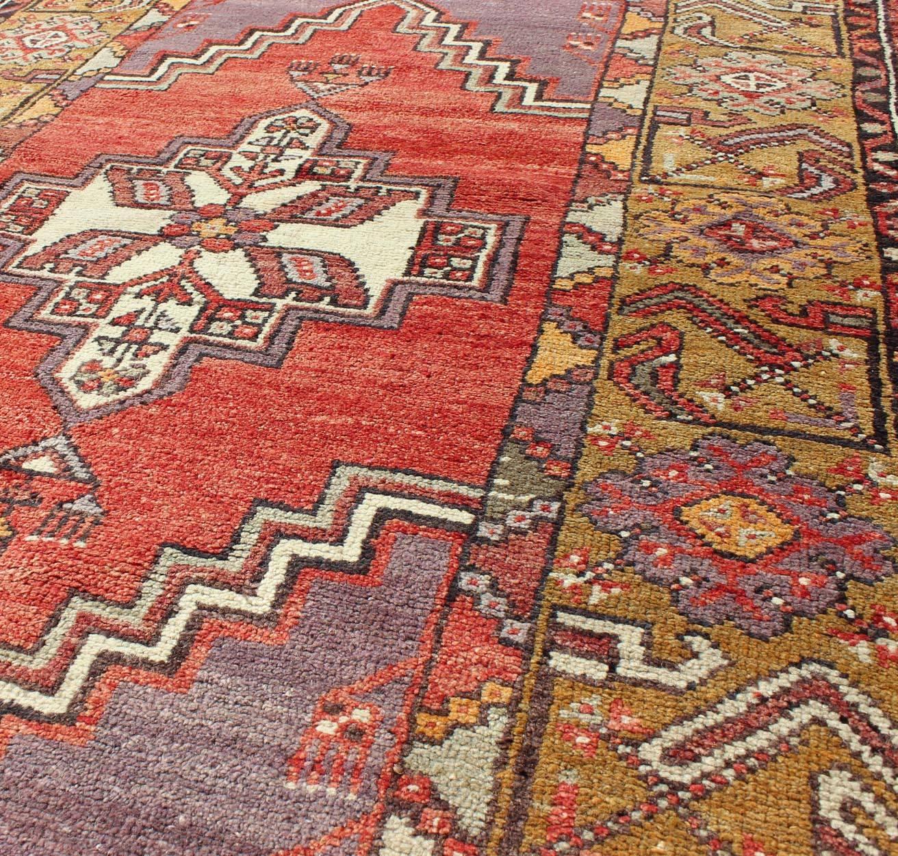 20th Century Geometric Vintage Turkish Oushak Carpet in soft Red, Light Purple, & Gold Border For Sale