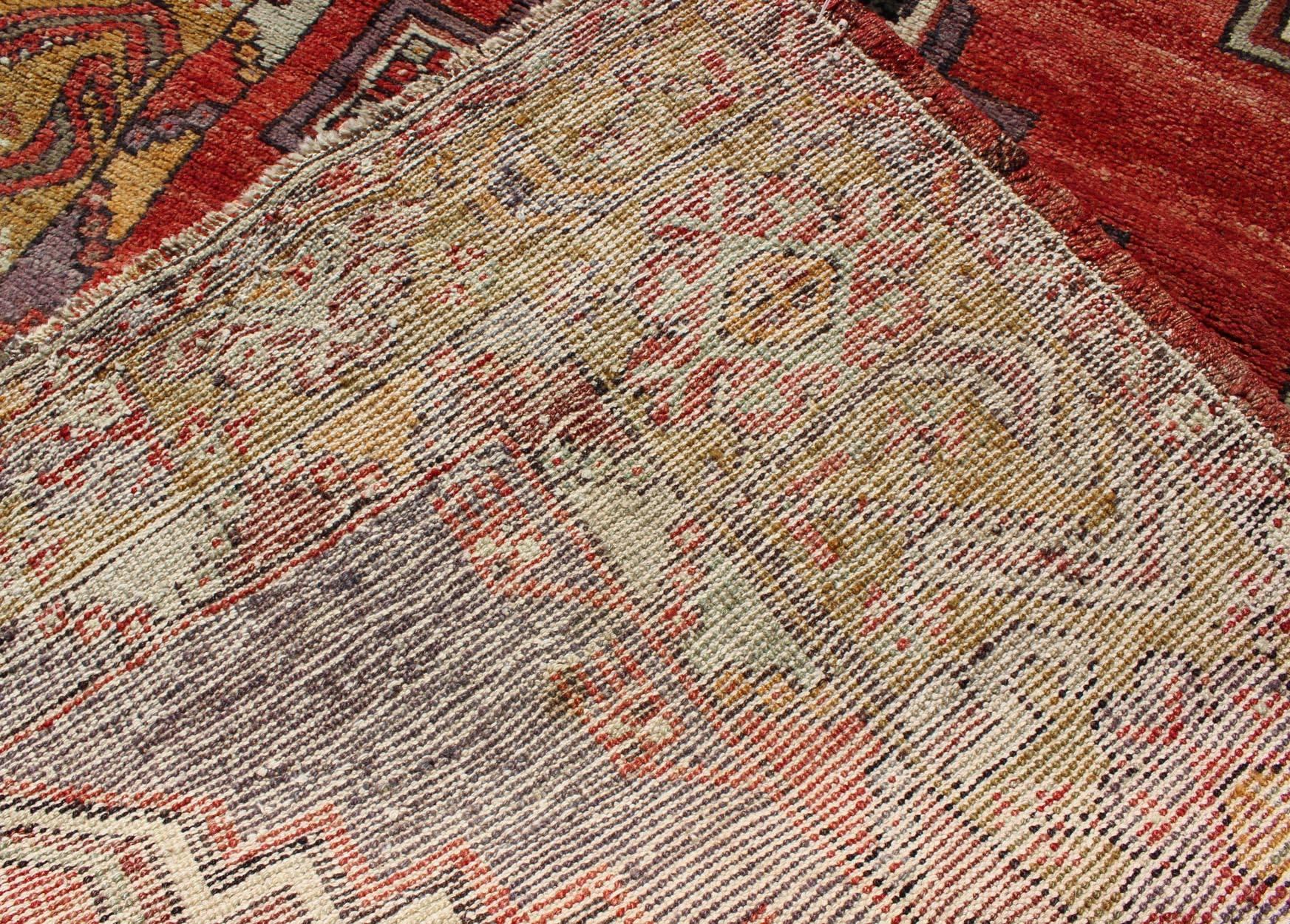 Wool Geometric Vintage Turkish Oushak Carpet in soft Red, Light Purple, & Gold Border For Sale