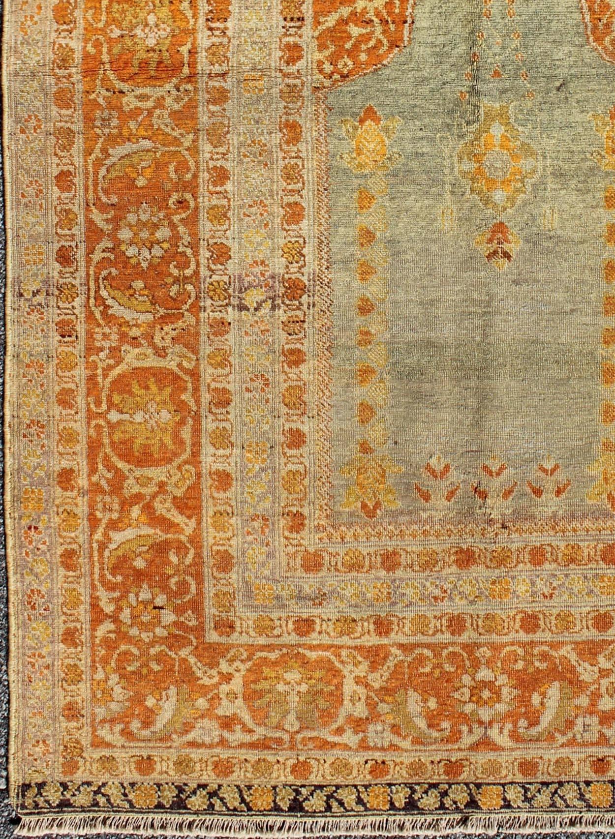 Turkish Sivas Antique with Prayer Design rug/ 13-0303  origin/turkey  

This lovely and finely woven rug displays a prayer design set on a light silver/blue background and framed by a copper/orange border. 
Measures: 4 x 6'2.