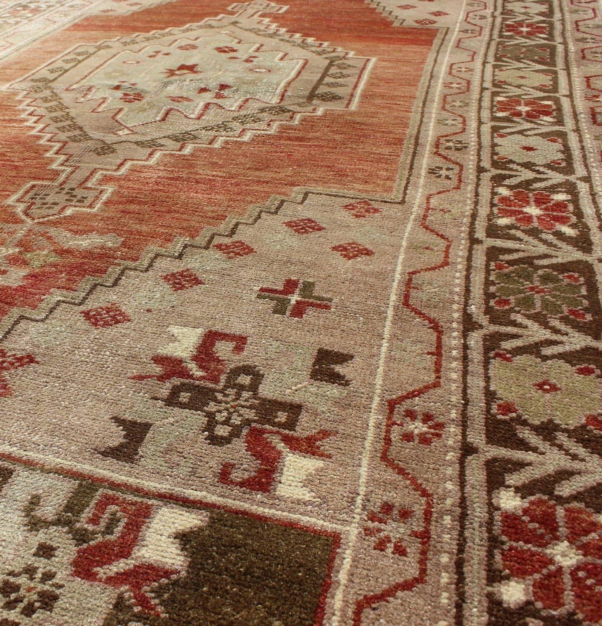 Vintage Oushak Rug With Geometric Motifs in Terracotta, Green and Tan In Excellent Condition For Sale In Atlanta, GA