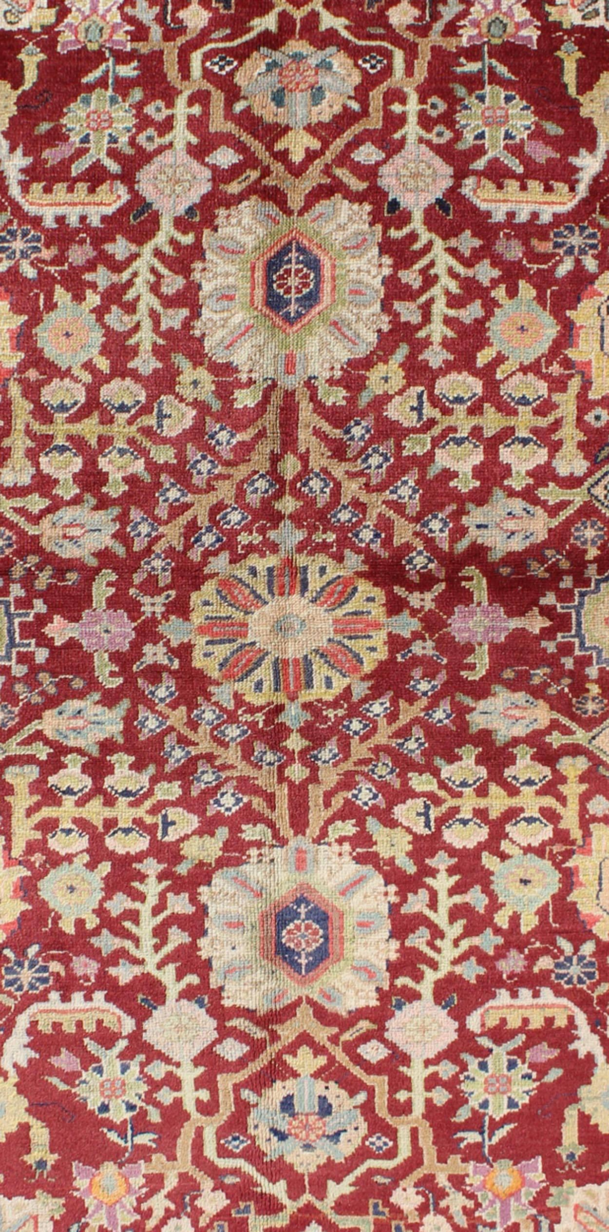 Hand-Knotted Colorful Turkish Oushak Carpet with Scattered Vines and Flowers on a Red Field For Sale