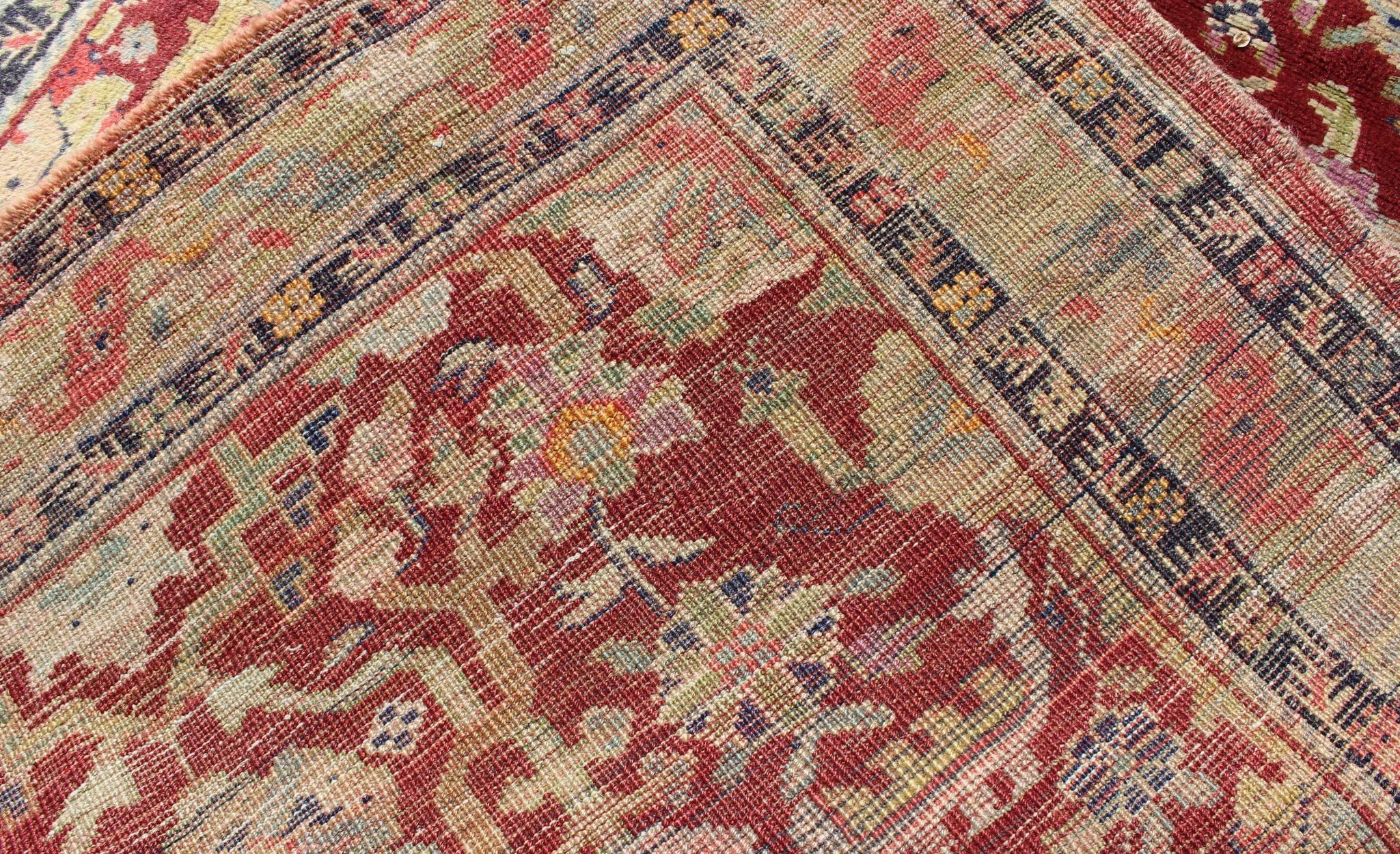 Wool Colorful Turkish Oushak Carpet with Scattered Vines and Flowers on a Red Field For Sale