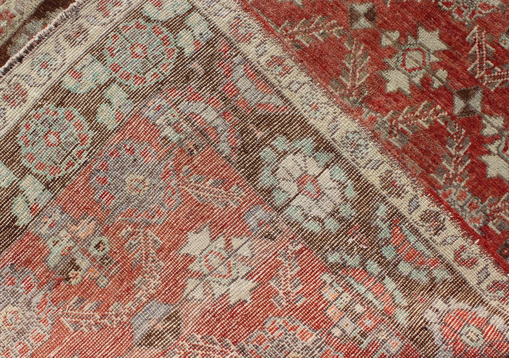 20th Century Oushak Rug With Interconnected Floral Designs in Red, Brown & Light Green For Sale