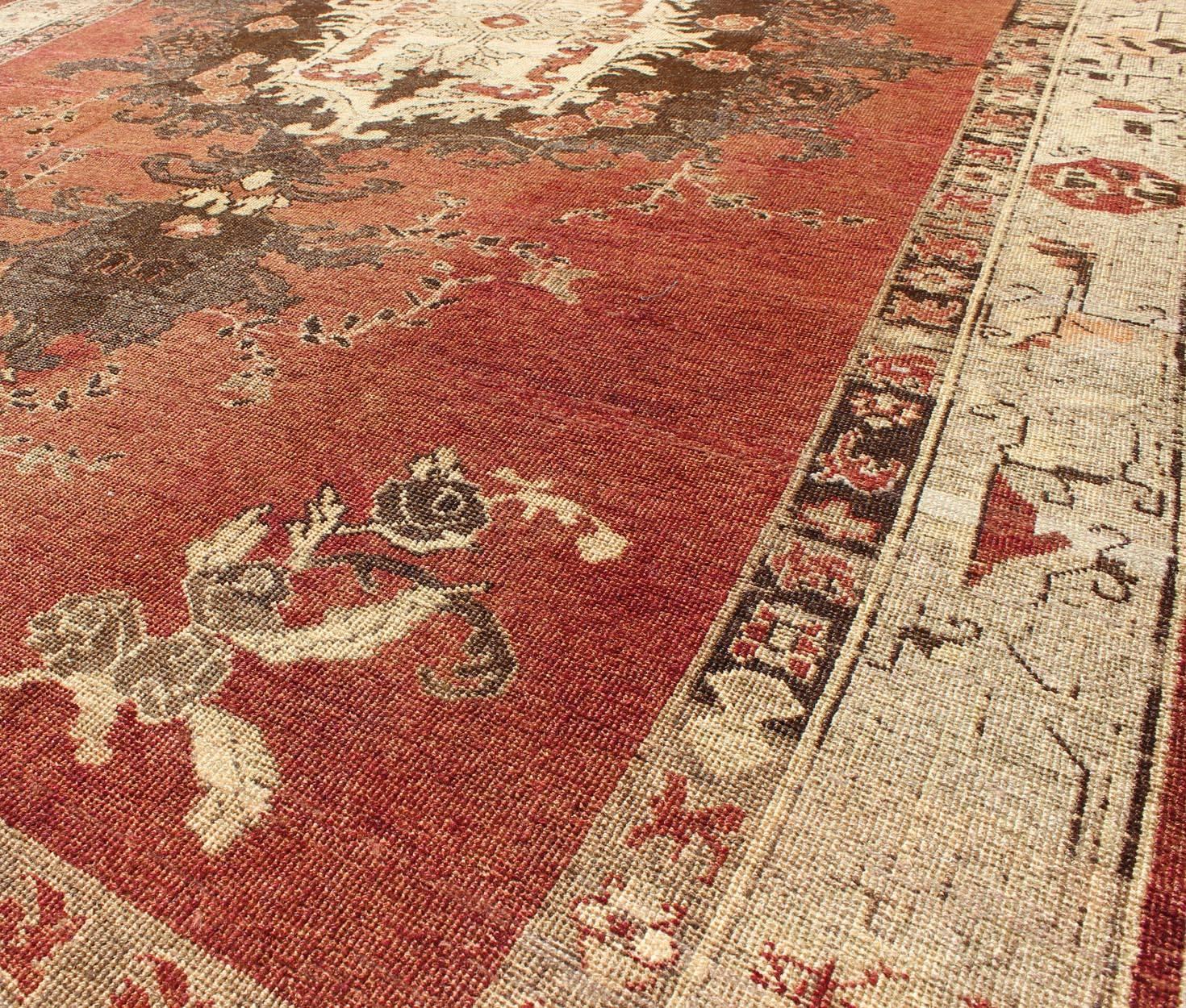 Vintage Oushak Carpet from Turkey with Faint Red Field and Floral Medallion In Excellent Condition For Sale In Atlanta, GA