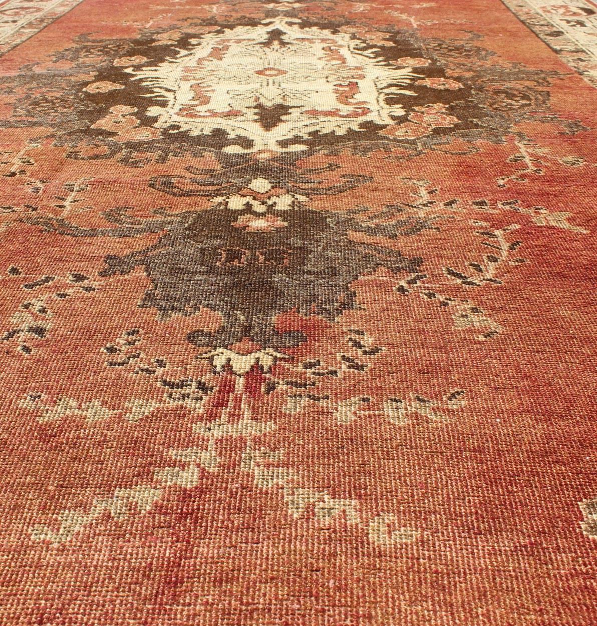 Mid-20th Century Vintage Oushak Carpet from Turkey with Faint Red Field and Floral Medallion For Sale