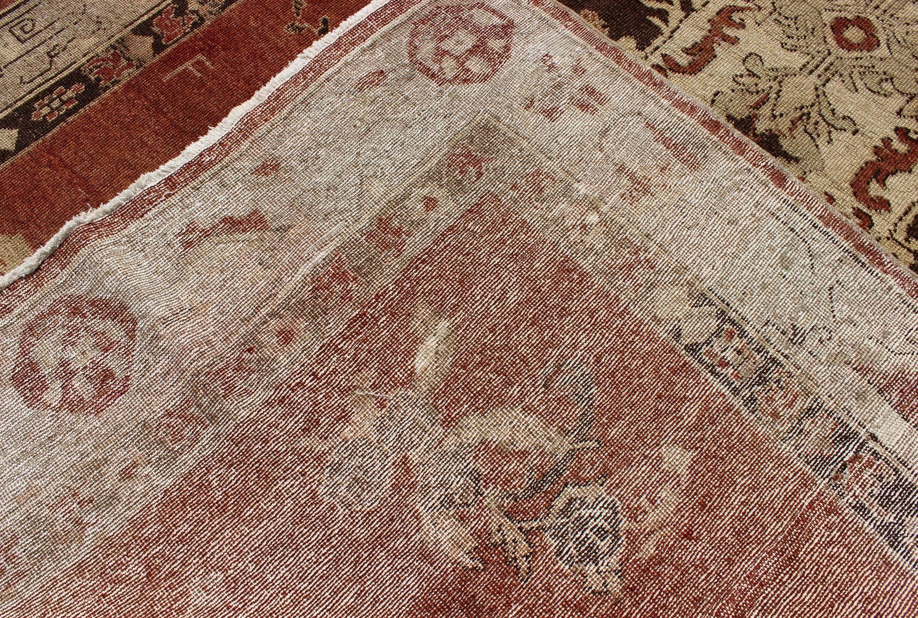Wool Vintage Oushak Carpet from Turkey with Faint Red Field and Floral Medallion For Sale