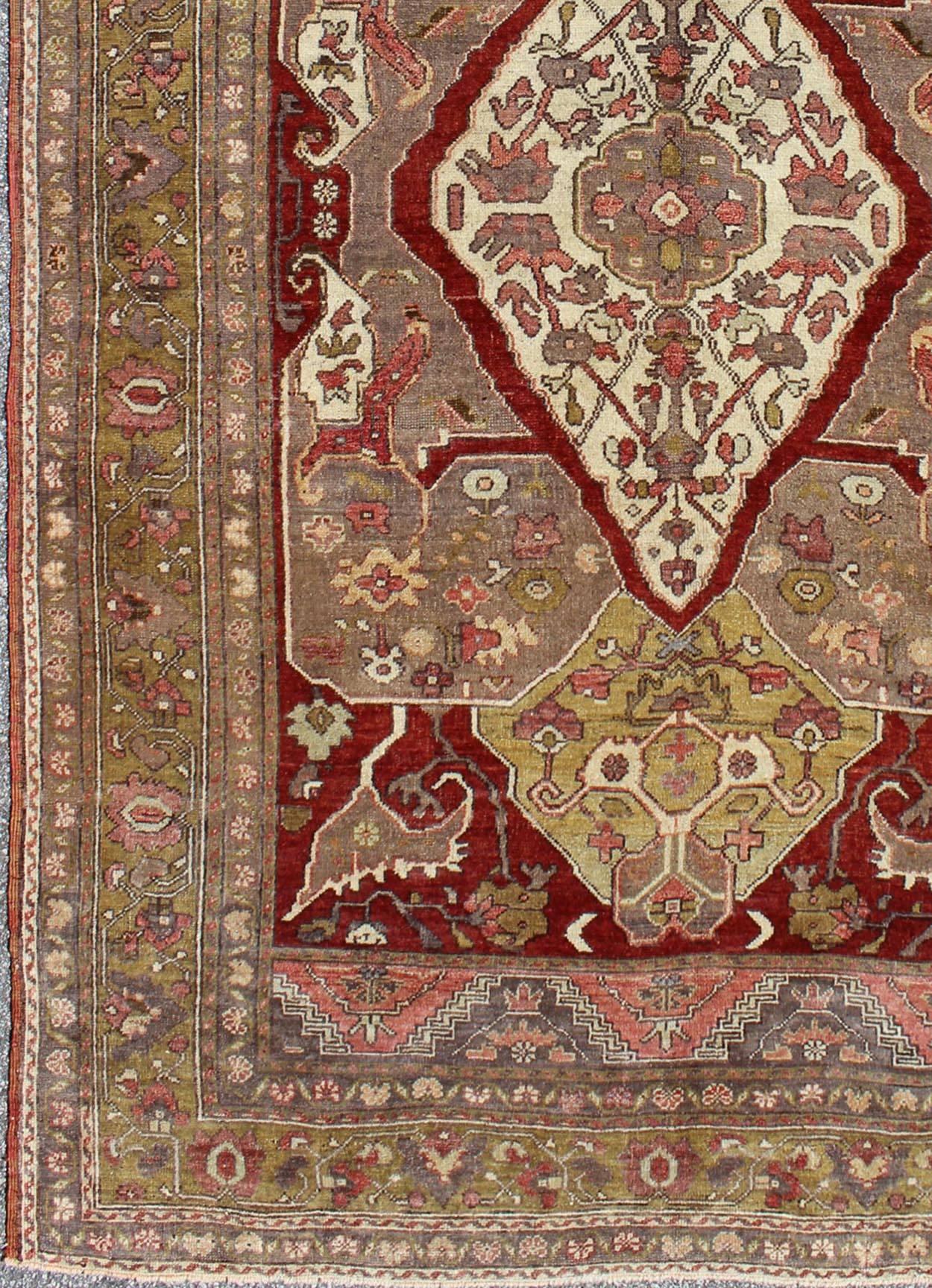 Turkish Oushak Carpet with Medallion Design and Intricate Floral Motifs rug/-en-3451   origin/turkey 

This unique, vintage Turkish Oushak rug features a unique blend of colors and an intricately beautiful design. The central medallion is