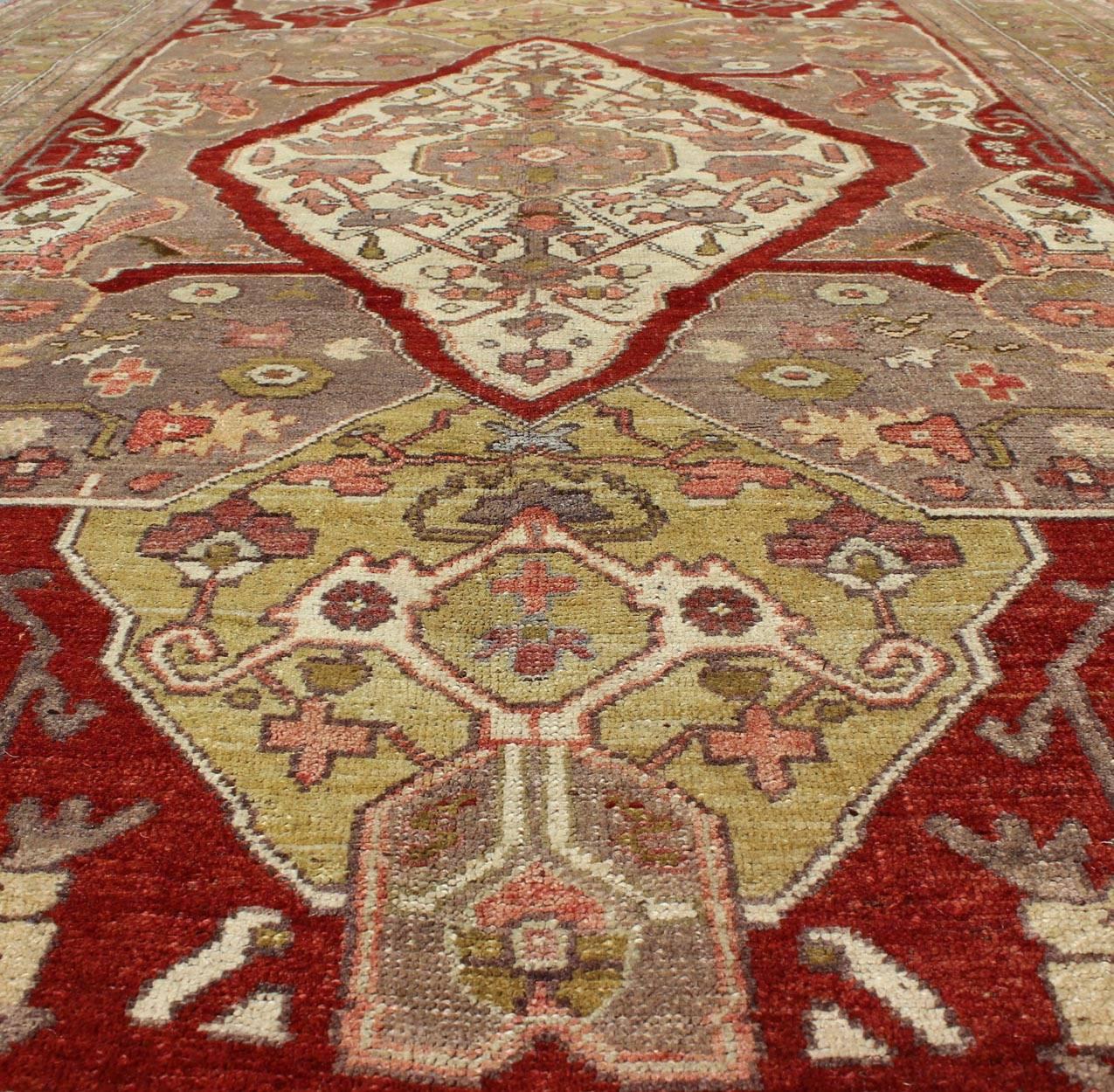 Unique Turkish Oushak Carpet with Medallion Design and Intricate Floral Motifs In Excellent Condition For Sale In Atlanta, GA