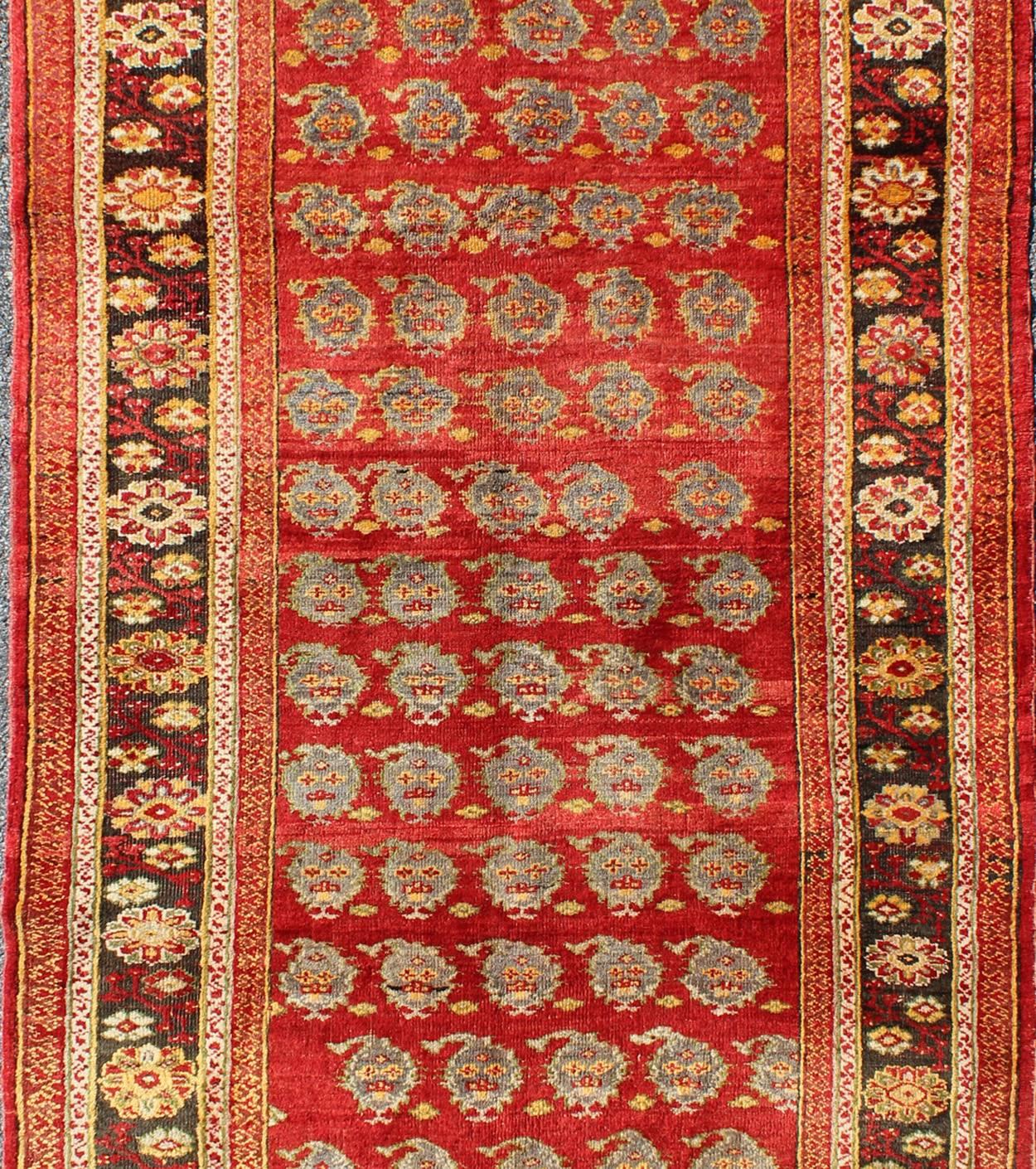 Hand-Knotted Vintage Turkish Oushak Carpet with All-Over Paisley Design and Central Red Field For Sale
