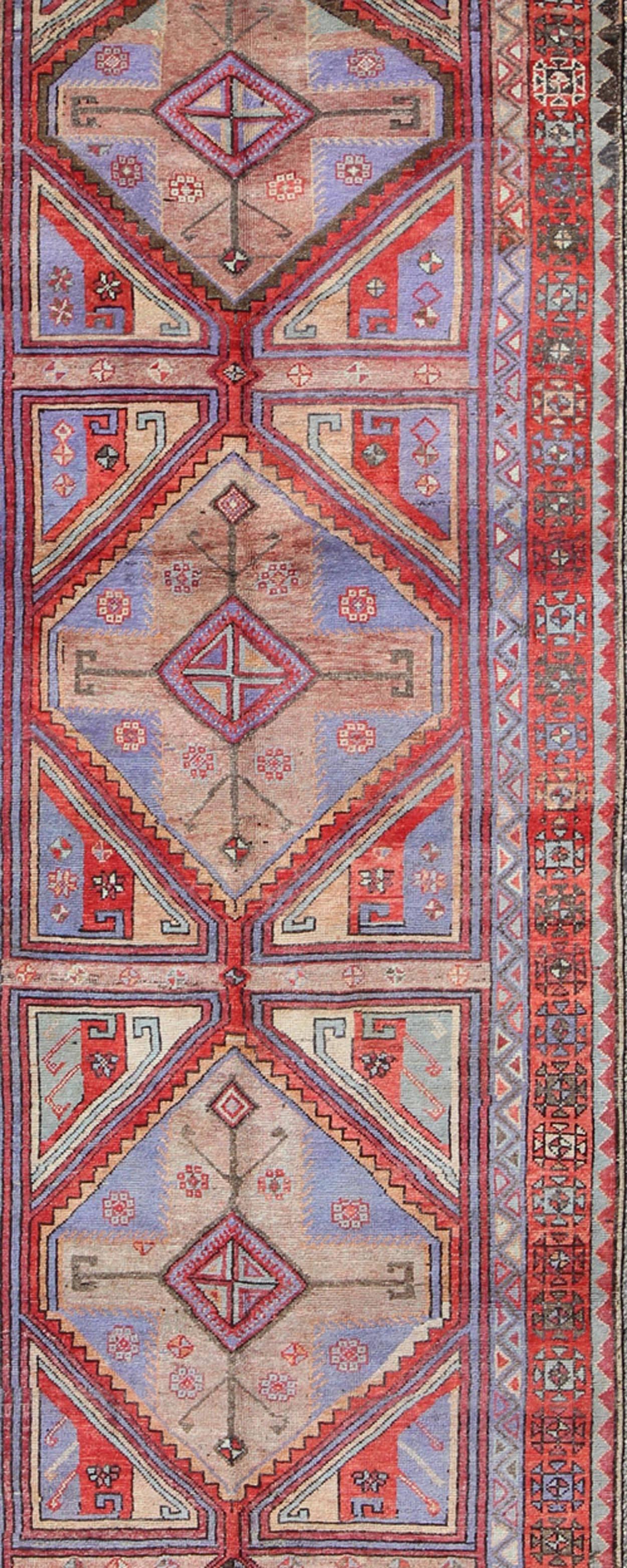 Hand-Knotted Vivid and Colorful Oushak Runner with Repeating Diamond Medallions For Sale
