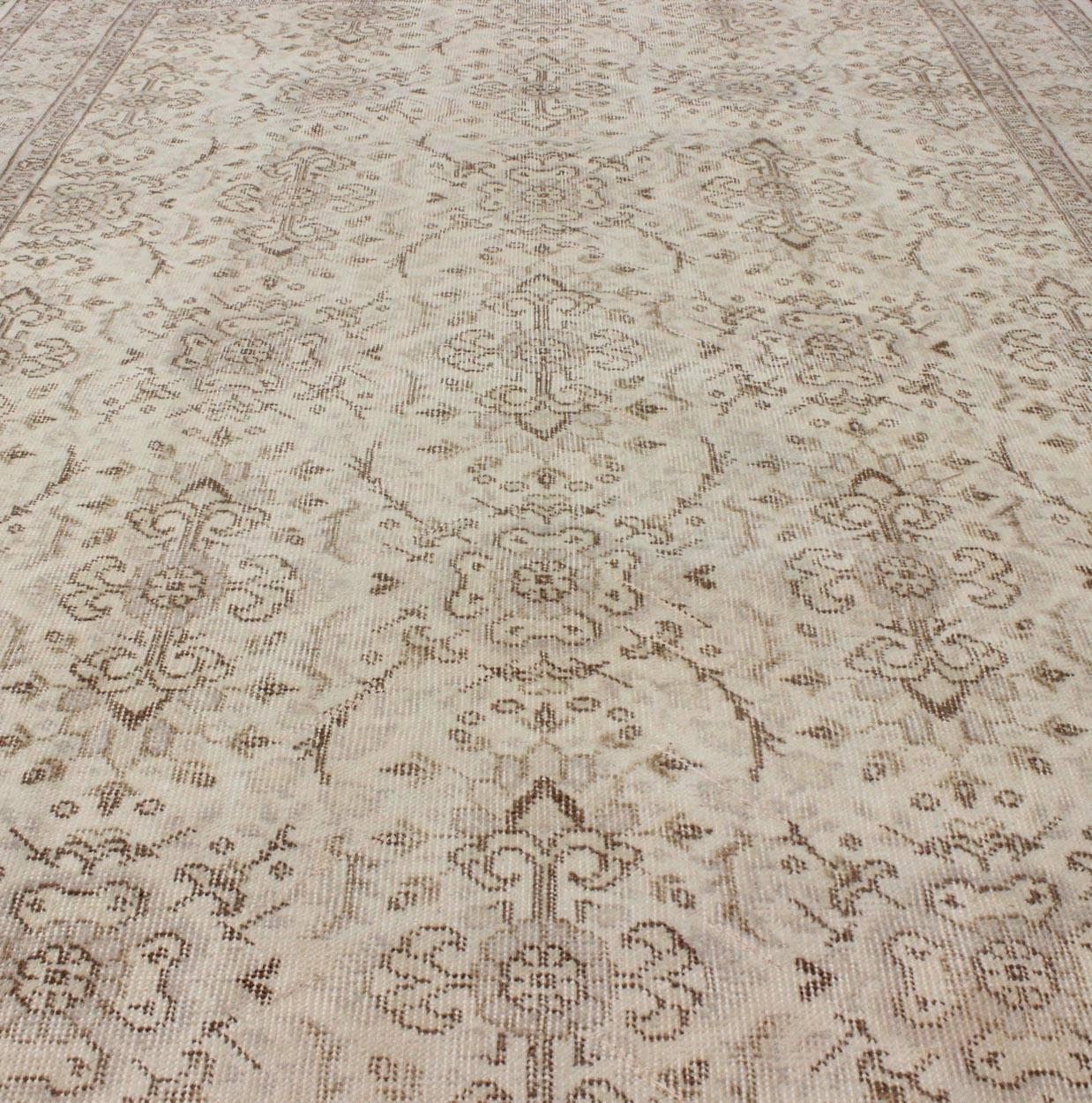 Wool Vintage Turkish Oushak Carpet with Botanical Motifs Set on an Cream Ground For Sale