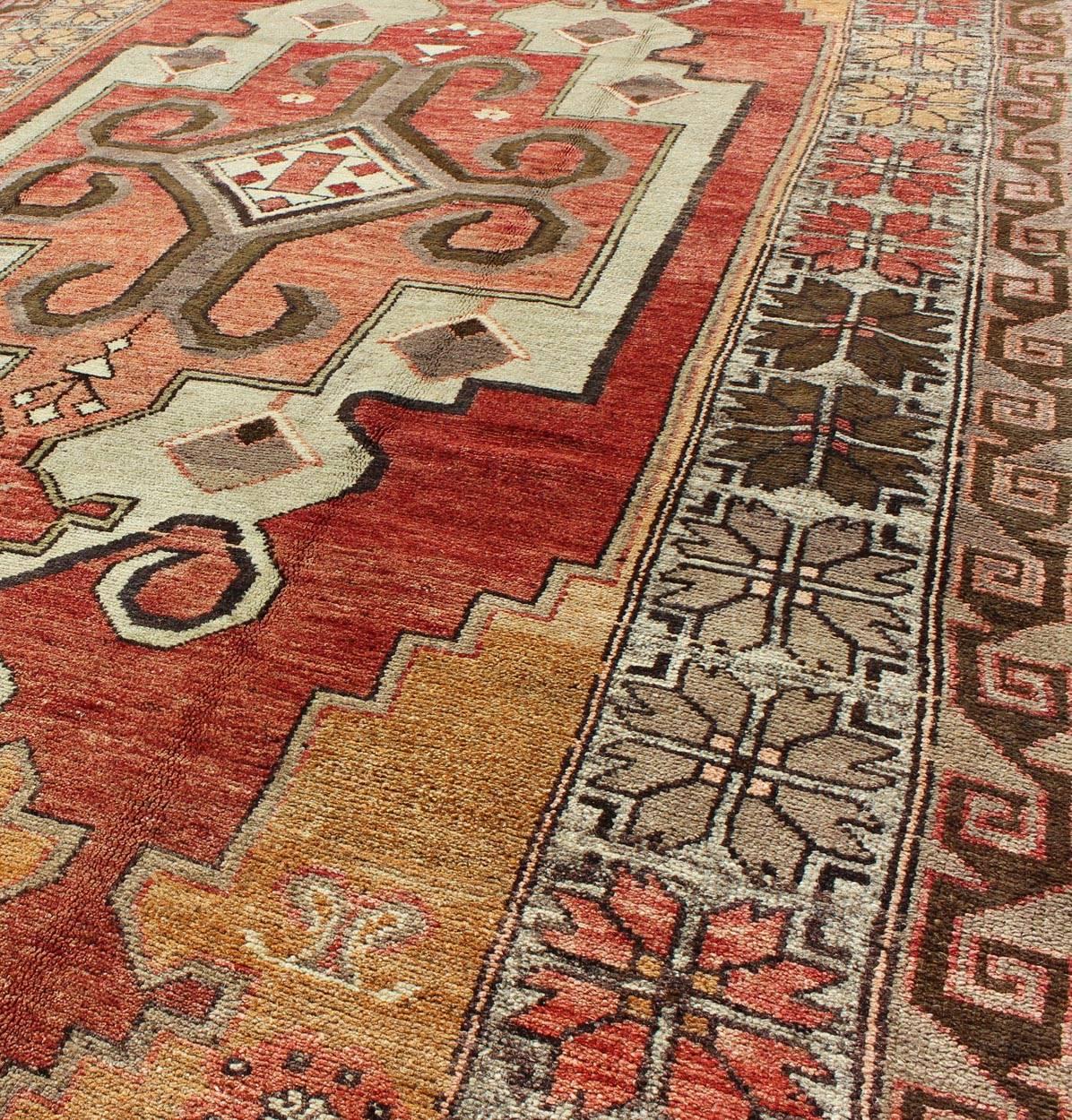 20th Century Vintage Turkish Oushak Rug with Geometric-Tribal Medallion in Red, Ivory & Gold For Sale