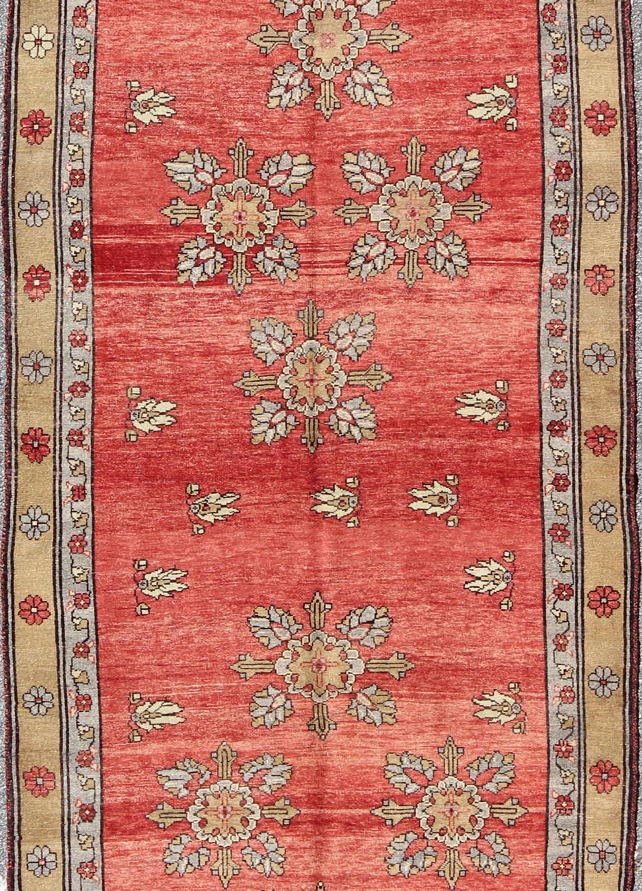 Hand-Knotted Vintage Turkish Oushak Carpet with Flowers in the Central Field and Borders For Sale