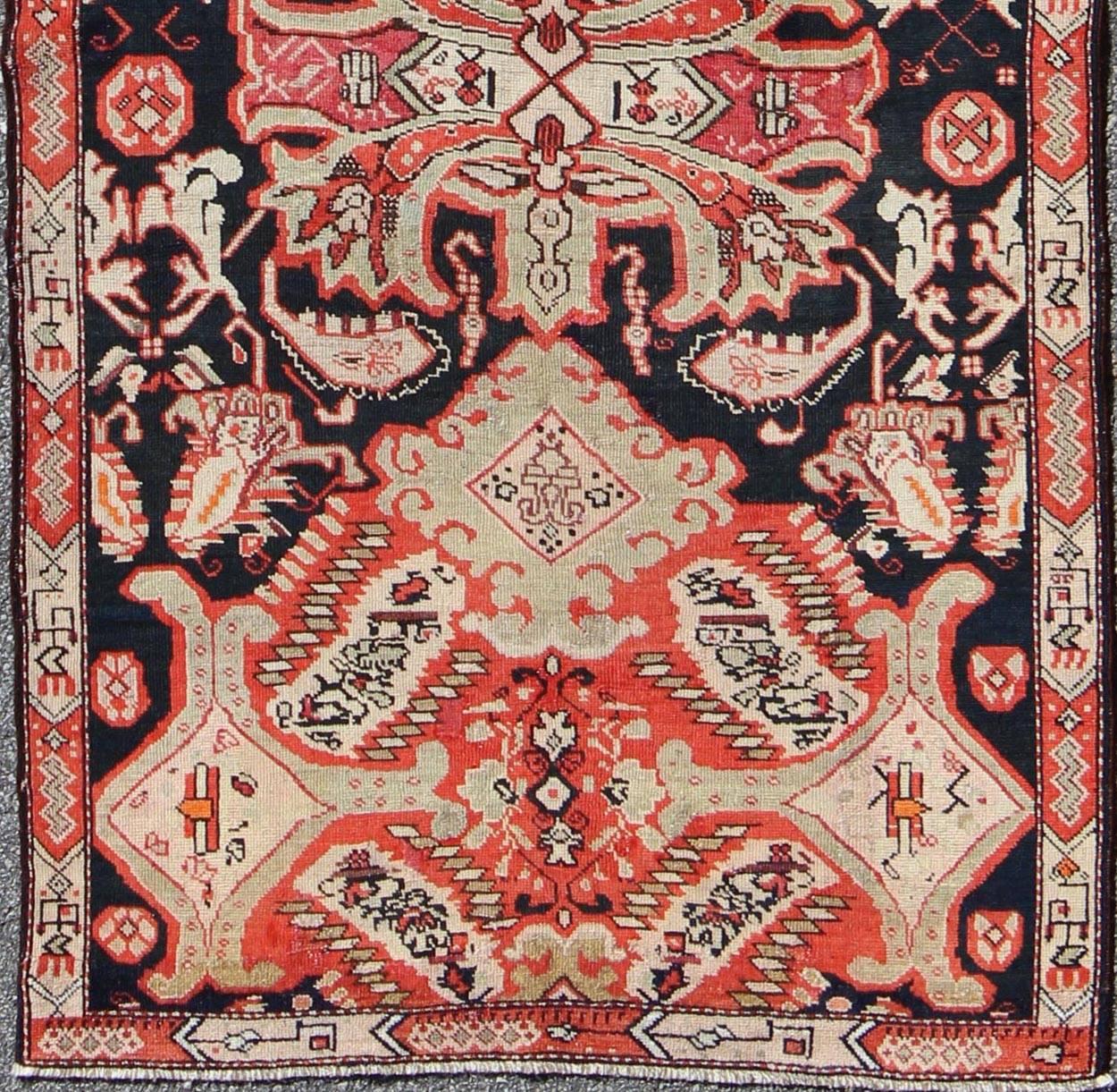 Antique Caucasian Karabagh Runner in Black Background, Orange, Green & Salmon.
This beautiful antique Karabagh displays an unusual multi-medallion design. The background is dark brown, while other colors include orange, light green and cream.
