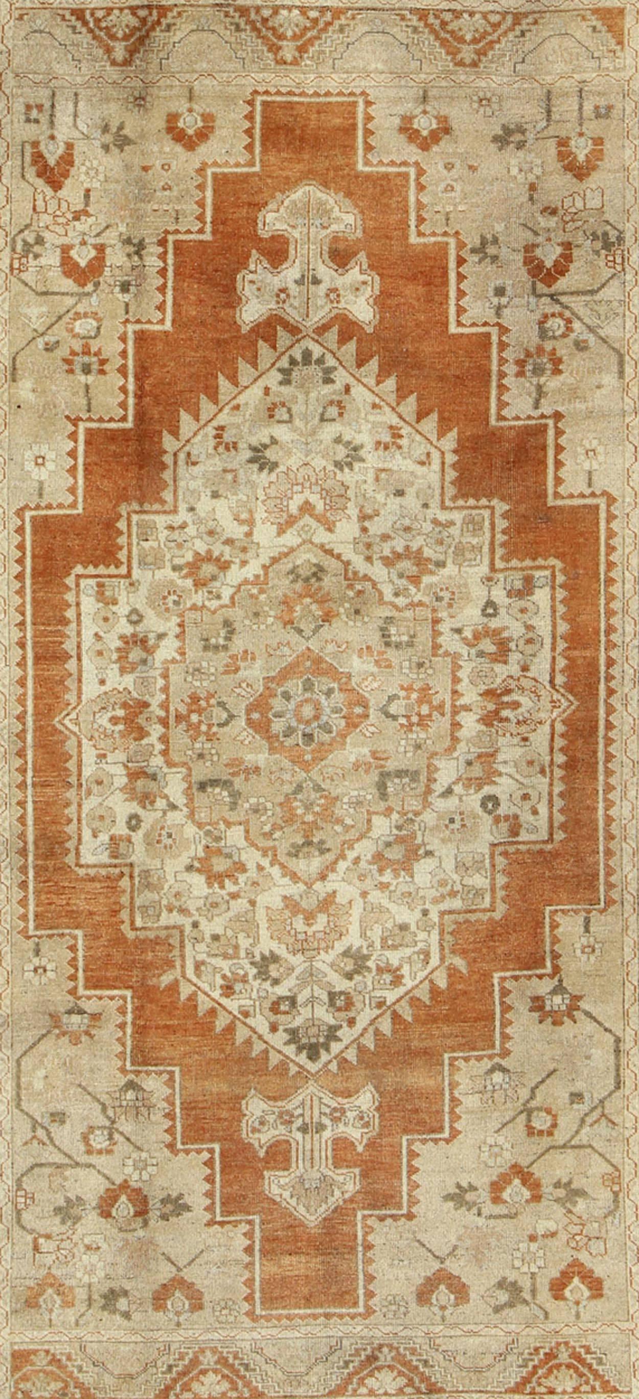 green and rust rug