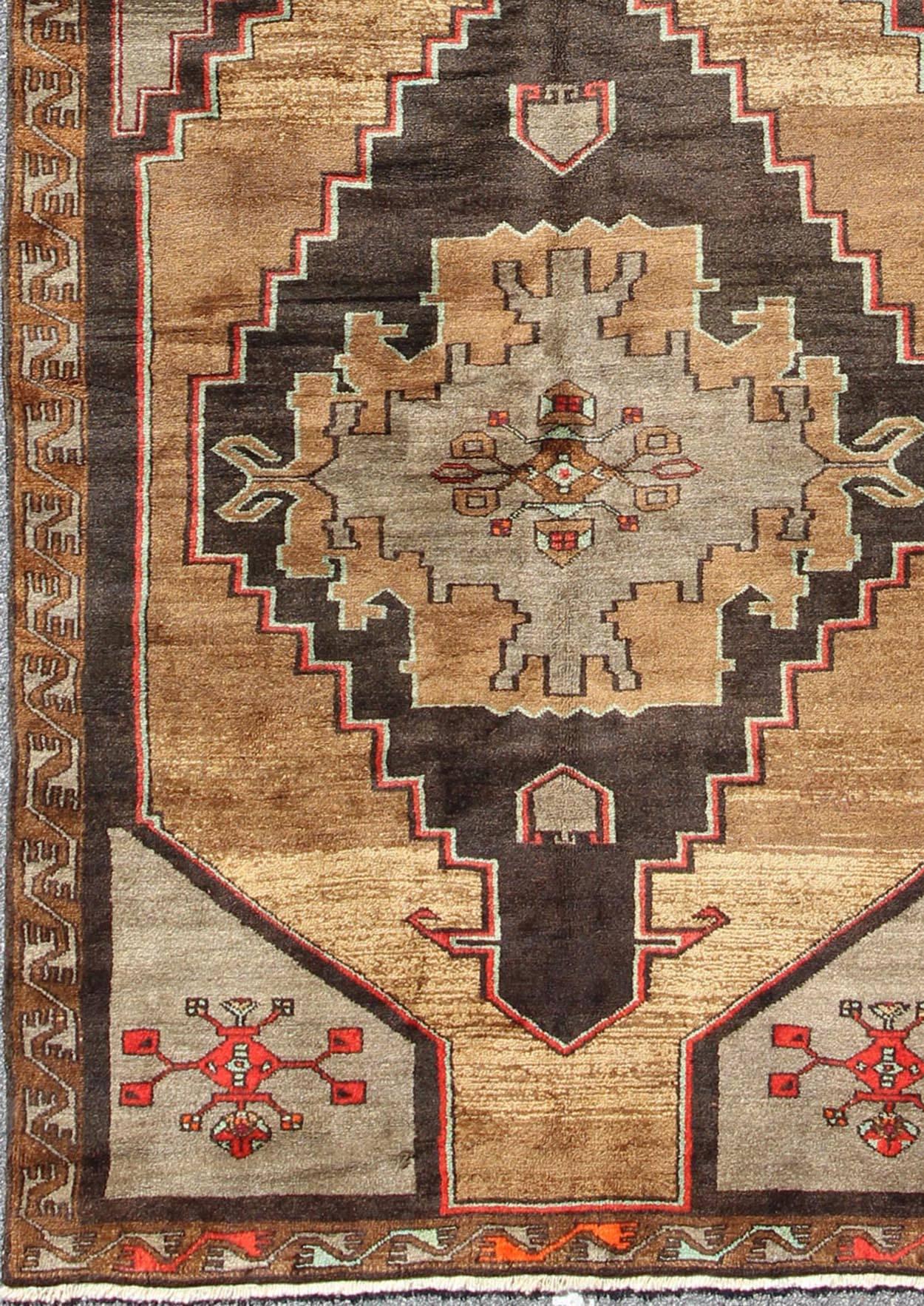 Full pile Gallery Vintage Turkish Runner in Gold, Brown, Taupe and Red Accents. Rug/TU-SIM-10

Measures: 6.2 x 15.2.

With two central, bold and striking medallions, this piece features rich colors of golden brown. A variation of goldish/camel