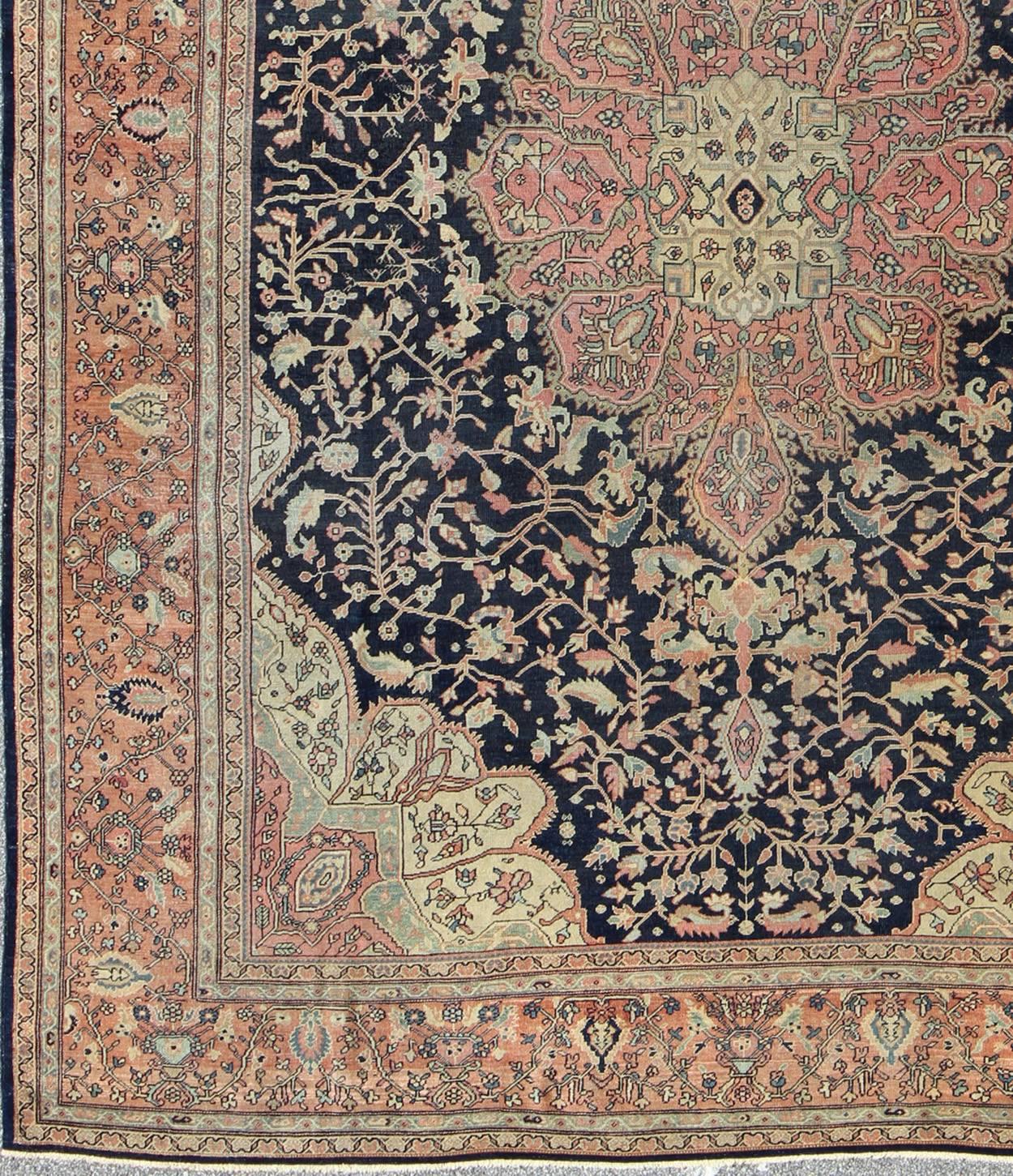 Antique Sarouk Farahan with Floral Motifs in Salmon, Green, Beige and Navy Blue. Keivan Woven Arts / rug / C-1002, country of origin / type: Iran / Antique Persian Feraghan Sarouk , circa 1900.

This outstanding antique Farahan Sarouk rug, from late