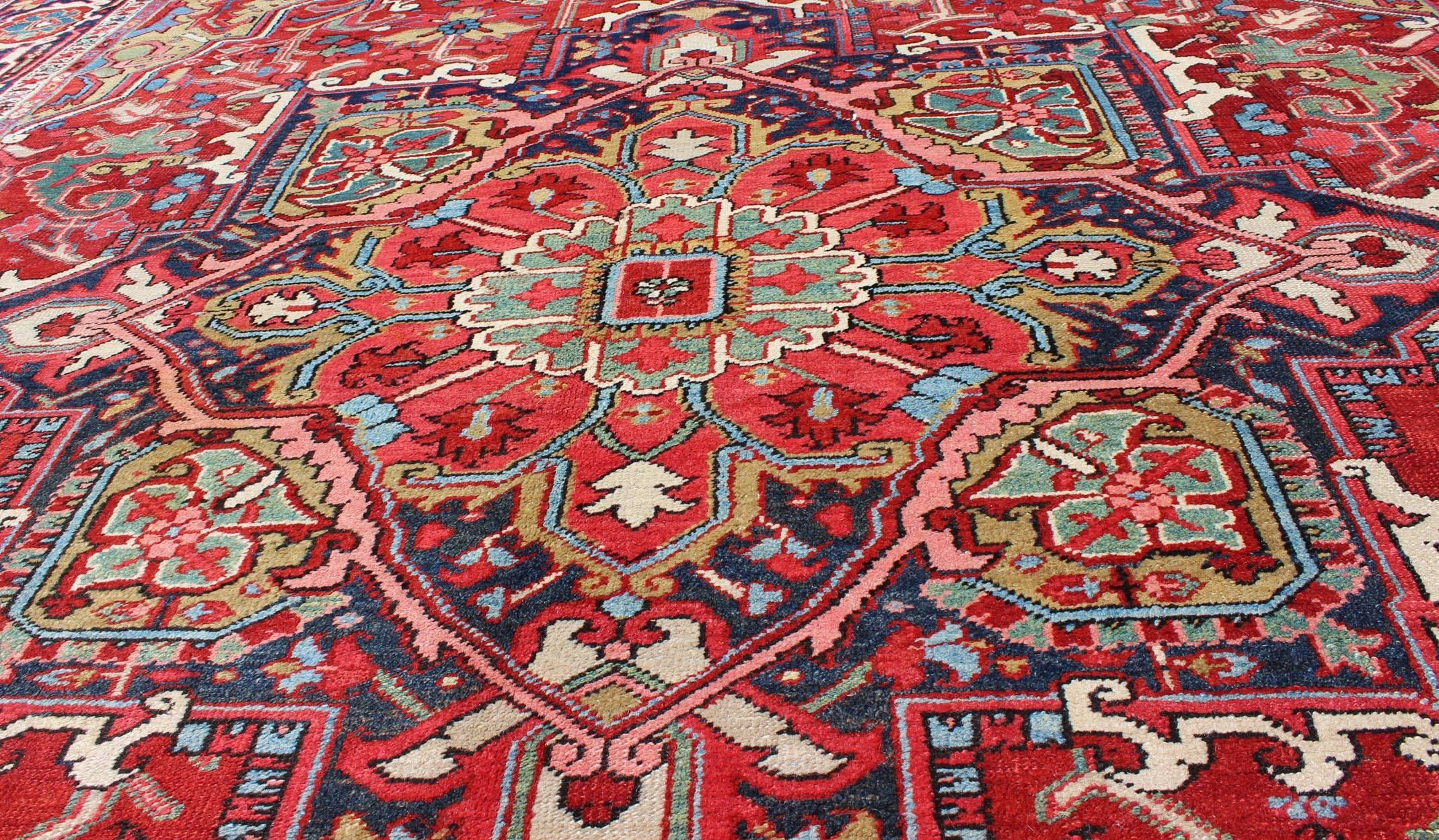 Persian Antique Heriz Carpet with Stylized Floral Motifs and Complementary Border For Sale