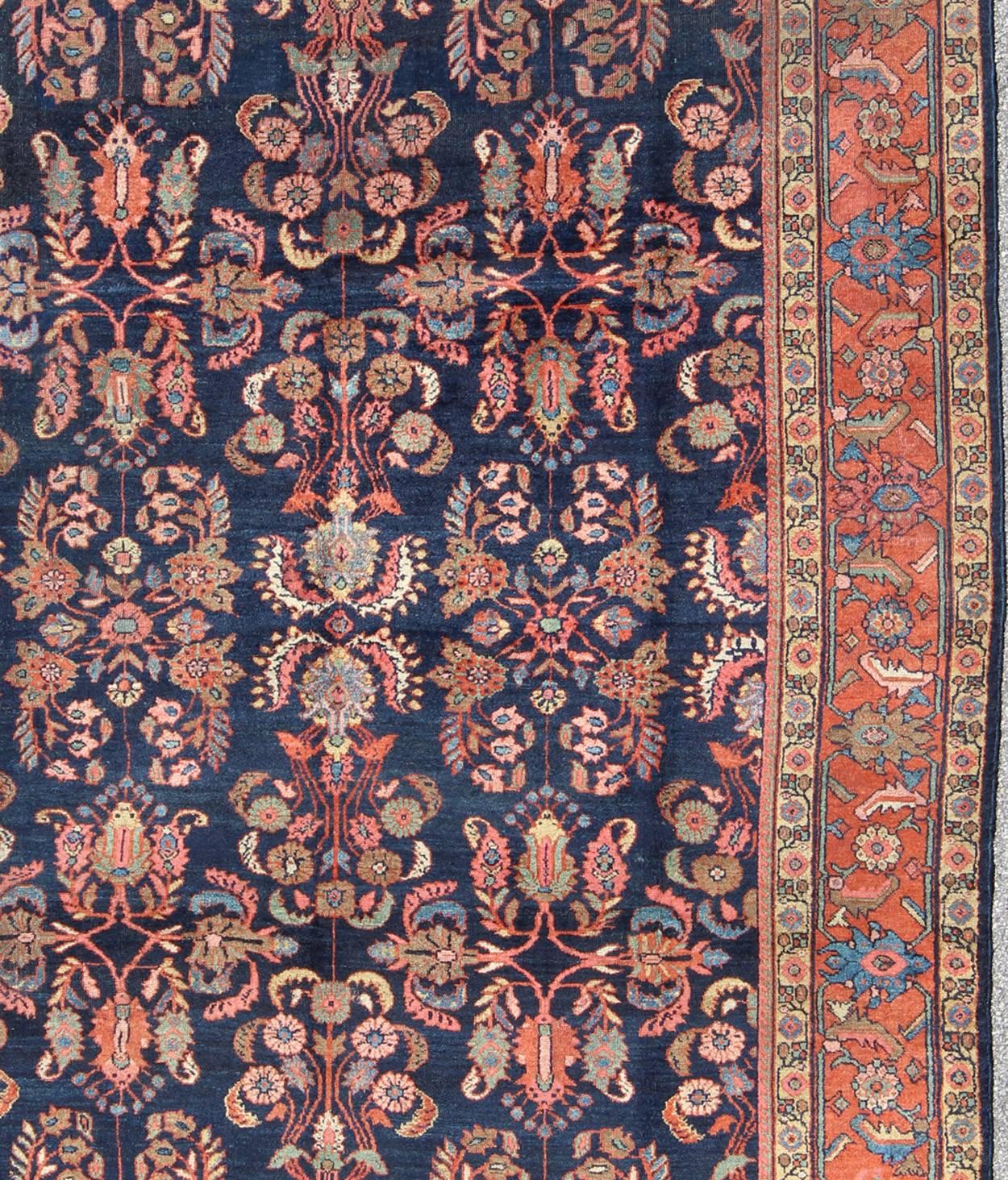 Persian  Antique Mahal Rug with Dark Blue Field & Coral Red Border with Floral Motifs For Sale