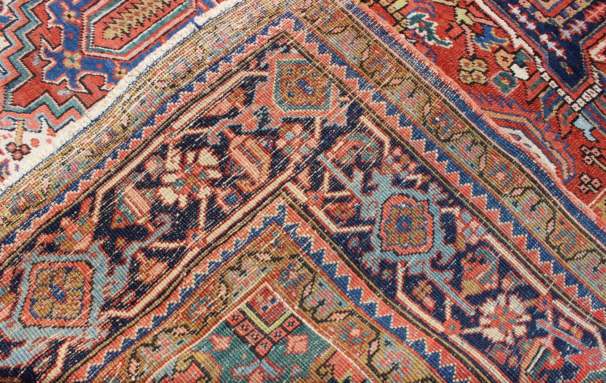 Wool Antique Colorful Persian Heriz Rug with Geometric Patterns and Intricate Design For Sale