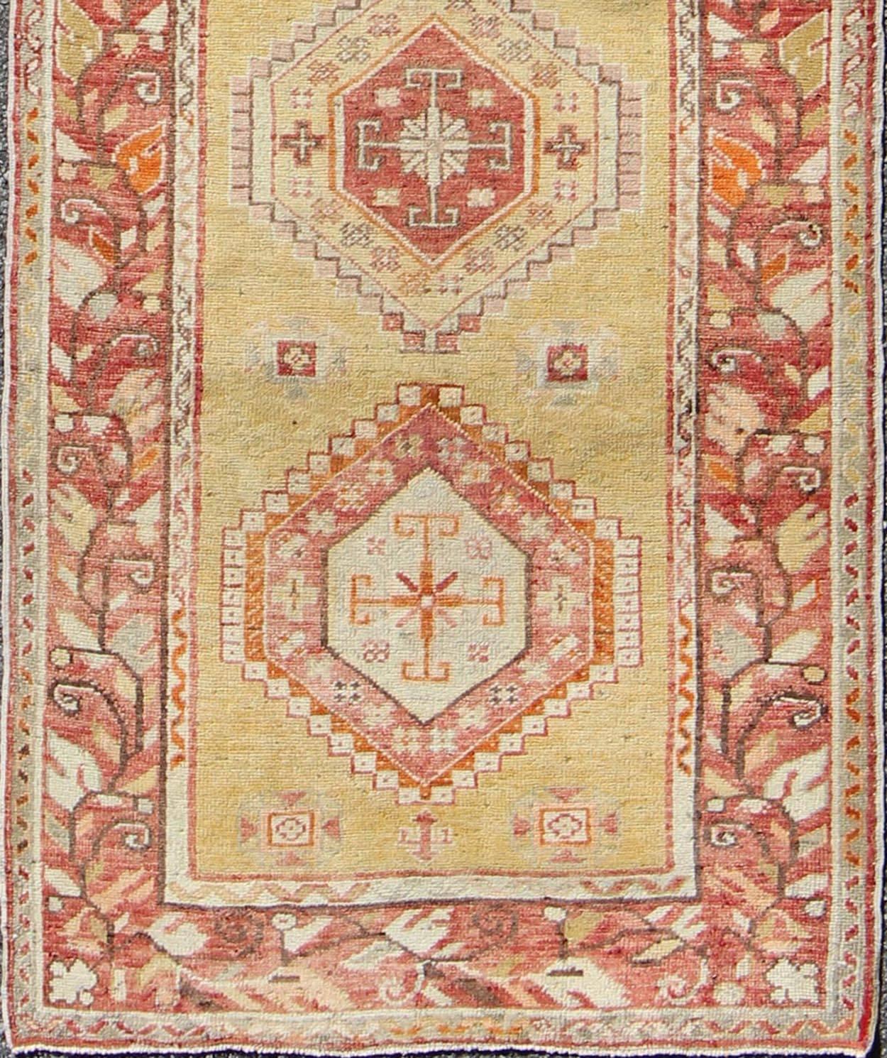 Turkish Oushak Runner with Geometric Medallions in Yellow Background Terracotta Border
This magnificent antique Turkish Oushak displays a glorious coloration paired with superlative geometric design. The delightful hues of yellow, coral, ivory and